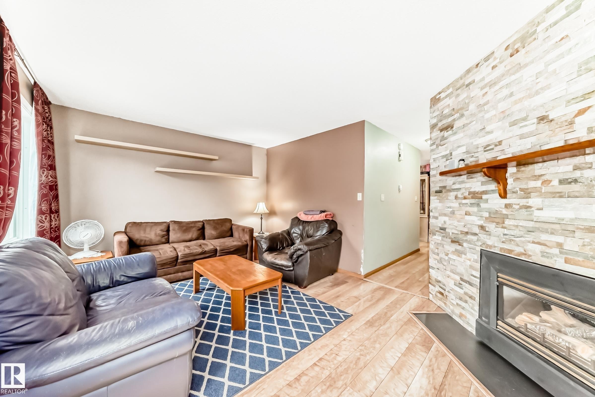 3151 139 Avenue Nw, Edmonton, AB - Indoor Photo Showing Living Room With Fireplace