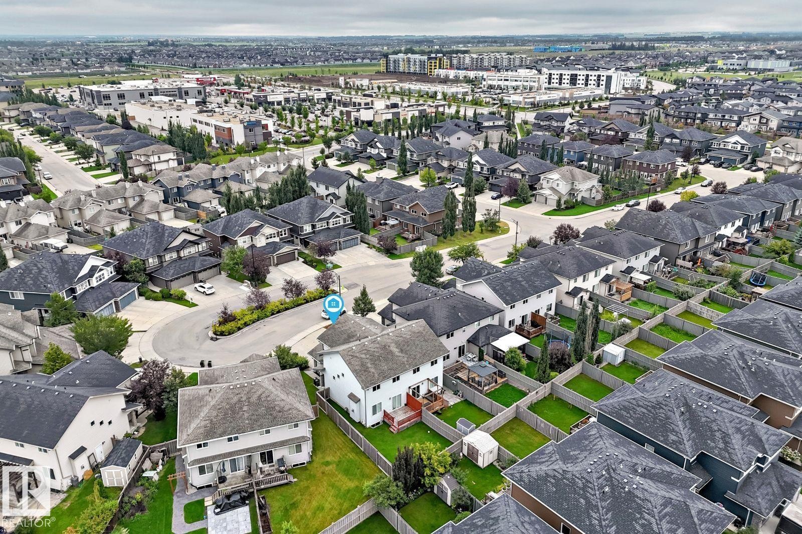 Residential neighborhood featuring a mix of detached and semi-detached homes, established landscaping, and paved streets - 1112 176 Street Sw, Edmonton, AB - Outdoor With View