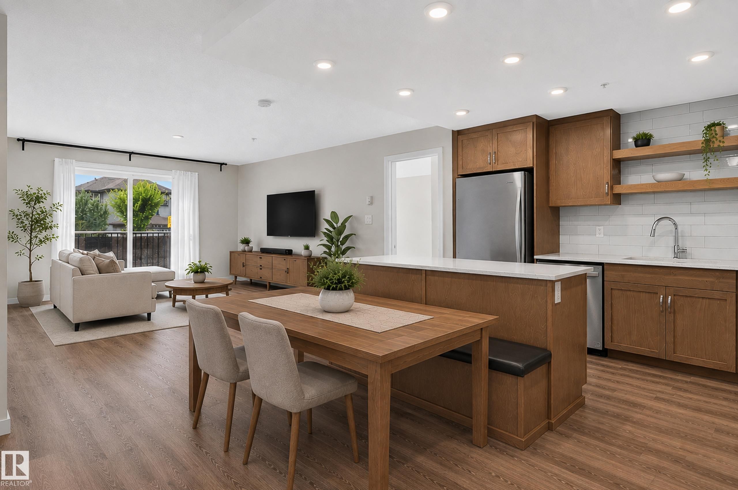 Open concept living space with wood-finish flooring - #131 5504 Schonsee Dr Nw, Edmonton, AB - Indoor