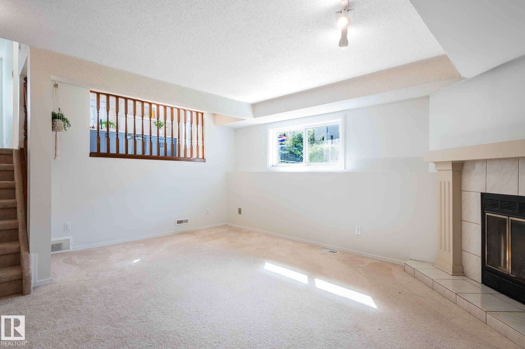 435 Ormsby Road Nw, Edmonton, AB - Indoor Photo Showing Other Room With Fireplace