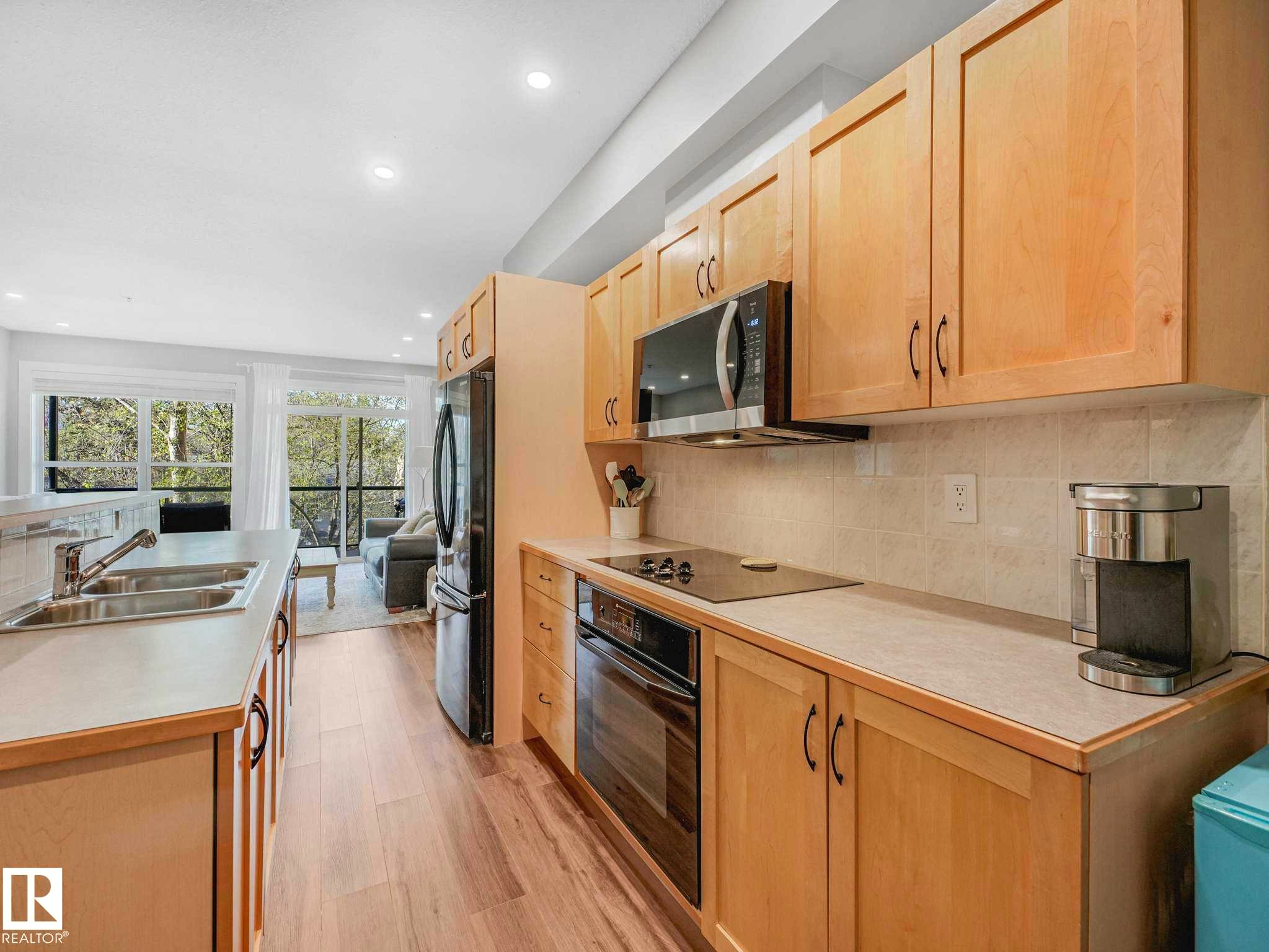 #302 11025 83 Av Nw, Edmonton, AB - Indoor Photo Showing Kitchen With Double Sink