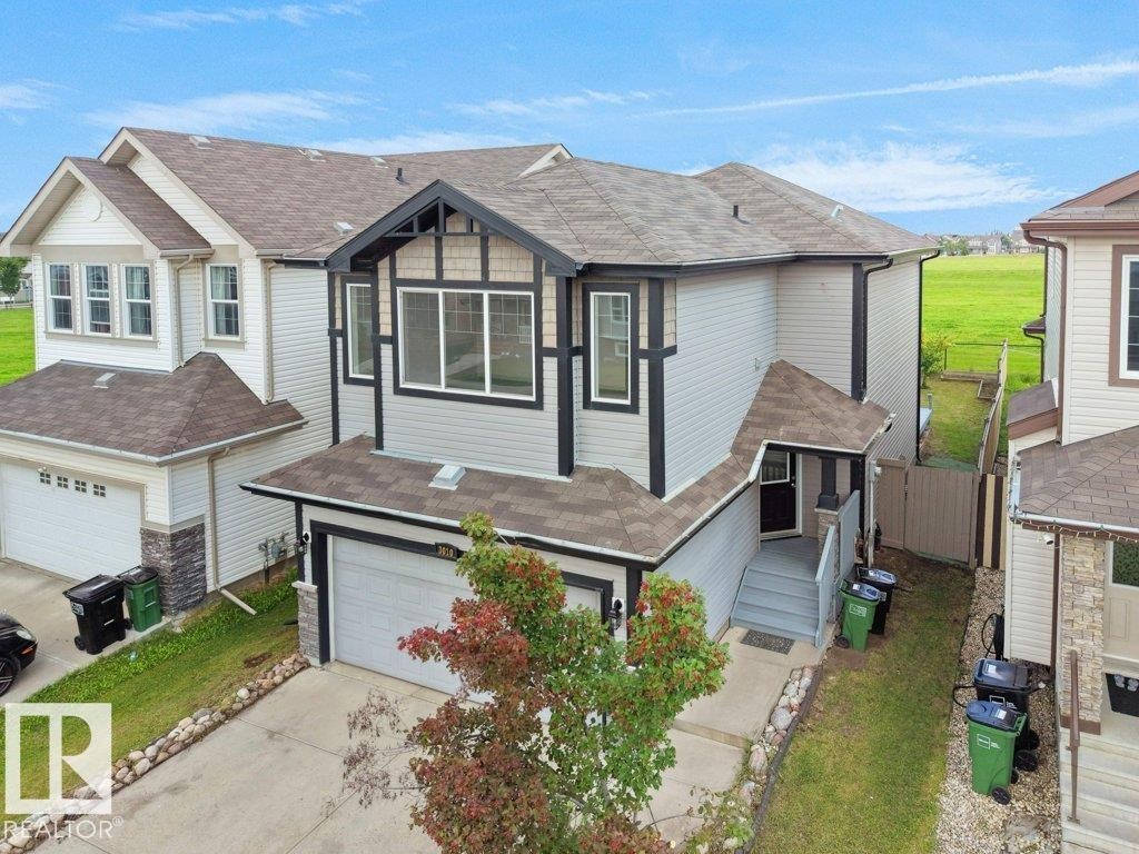 Two-story residence with a two-car garage and a paved driveway - 3010 17A Ave Nw, Edmonton, AB - Outdoor