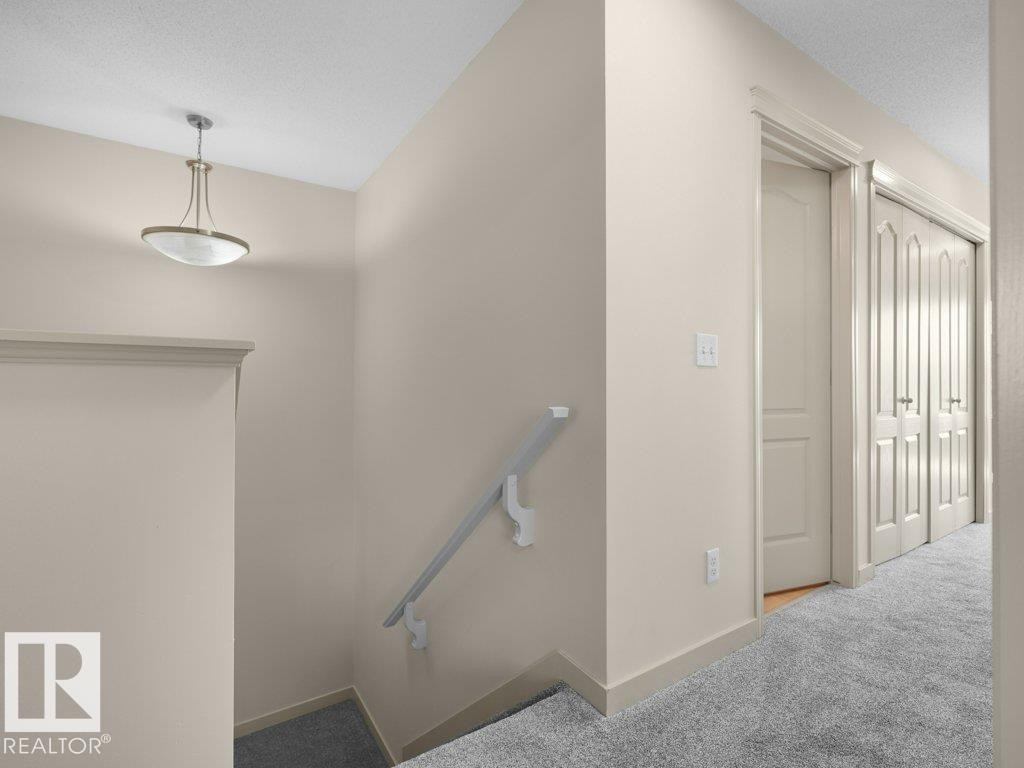 Recessed lighting fixture, light-toned wall paint, white trim, carpeted flooring, paneled doors - 3010 17A Ave Nw, Edmonton, AB - Indoor Photo Showing Other Room