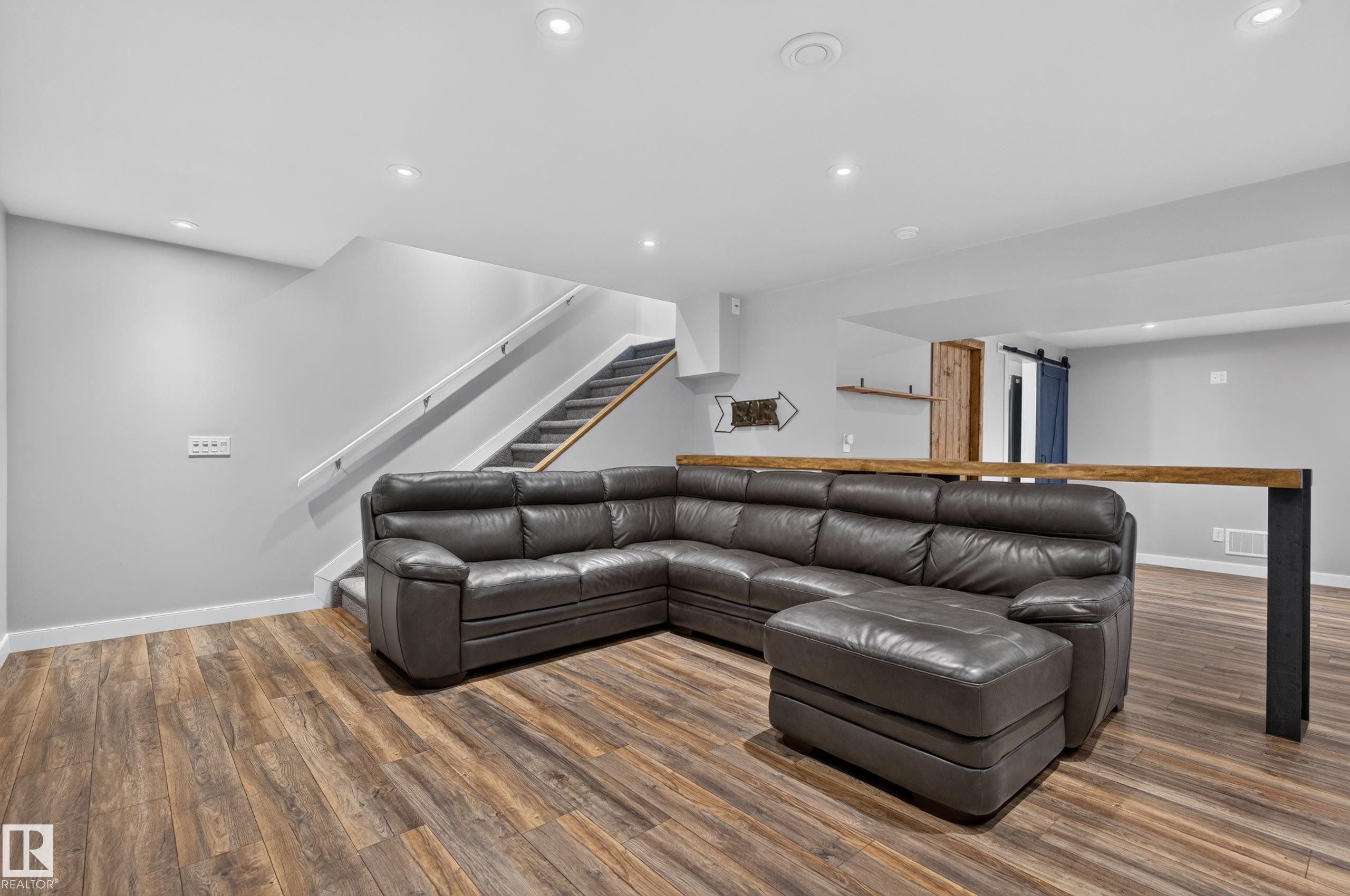 Open-concept living area featuring wood-finish flooring and recessed lighting - 6008 South Terwillegar Boulevard Nw, Edmonton, AB - Indoor