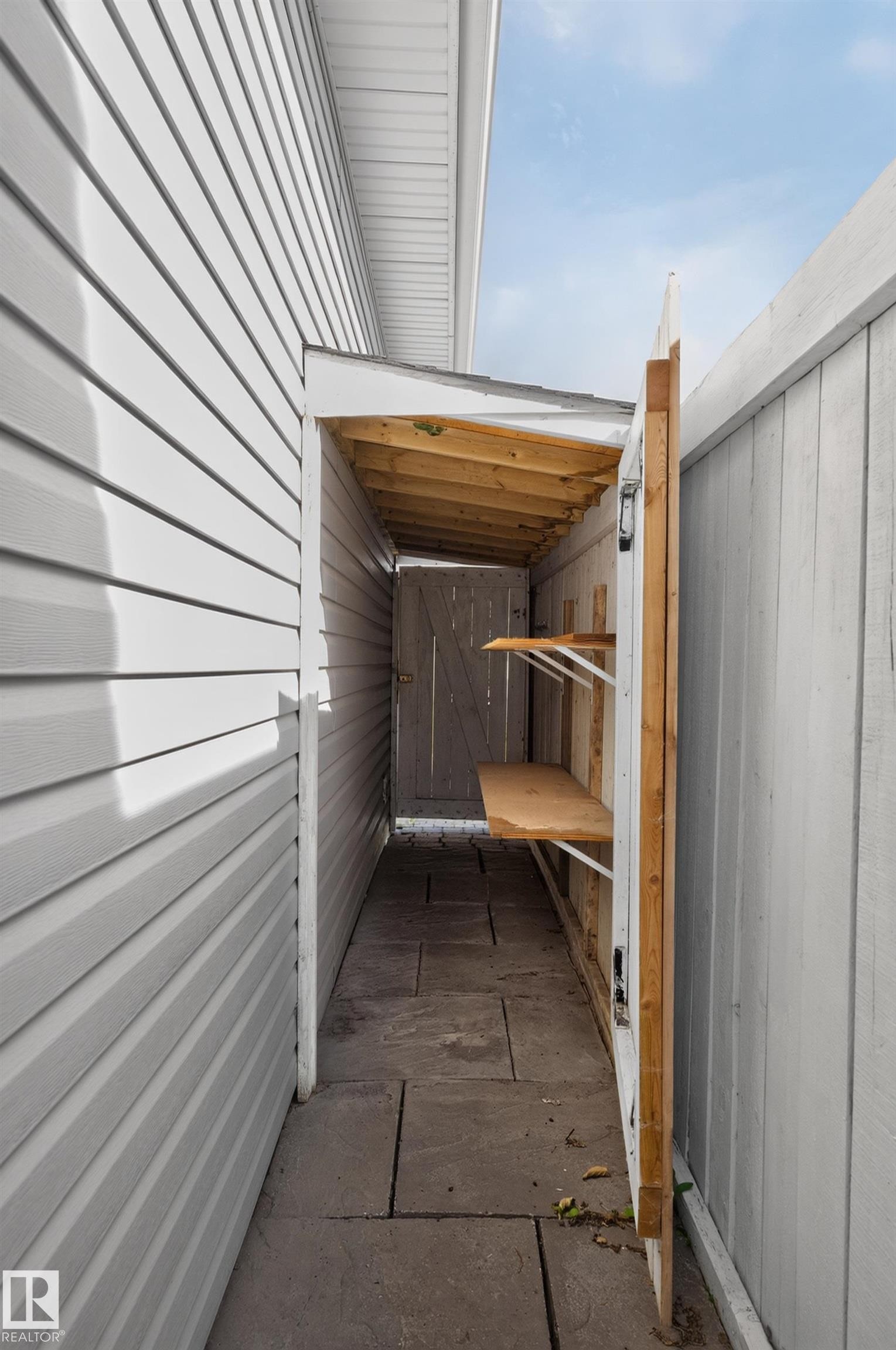 Siding exterior with a covered walkway and flagstone path - 6008 South Terwillegar Boulevard Nw, Edmonton, AB - Outdoor With Exterior