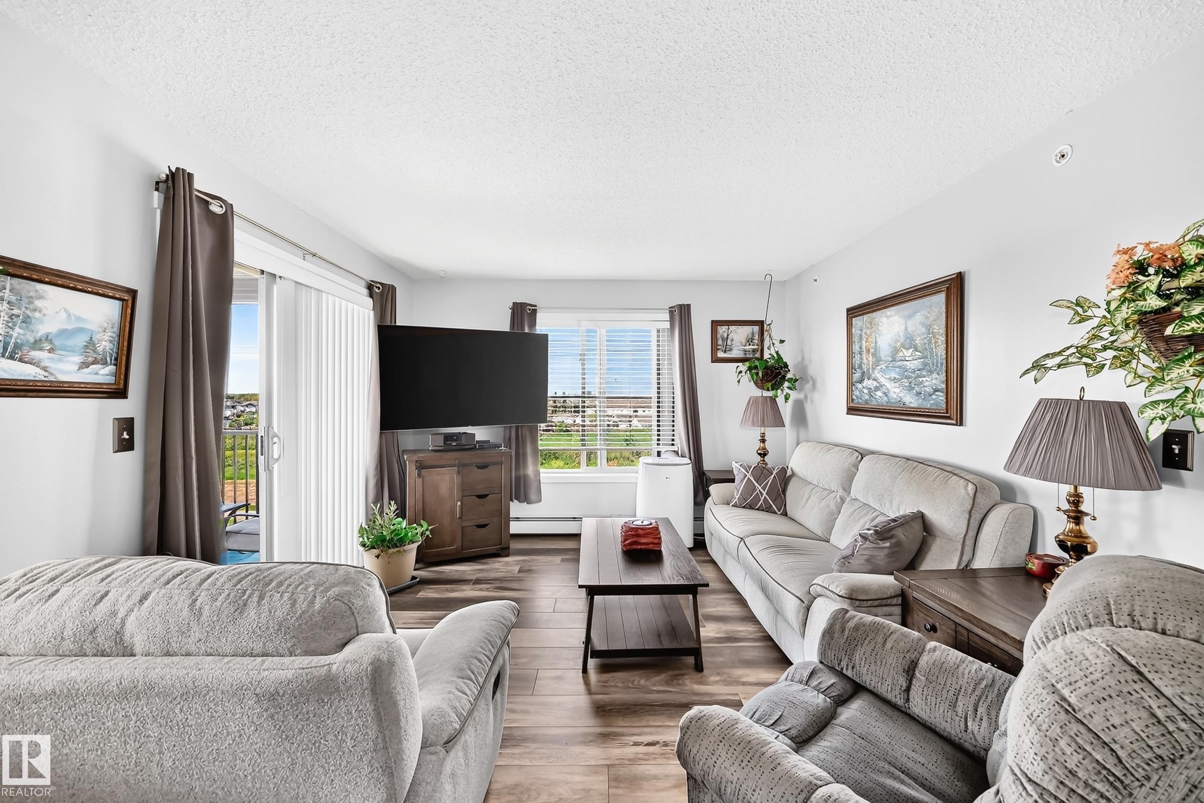 Wood-finish flooring throughout - #401 5390 Chappelle Rd Sw, Edmonton, AB