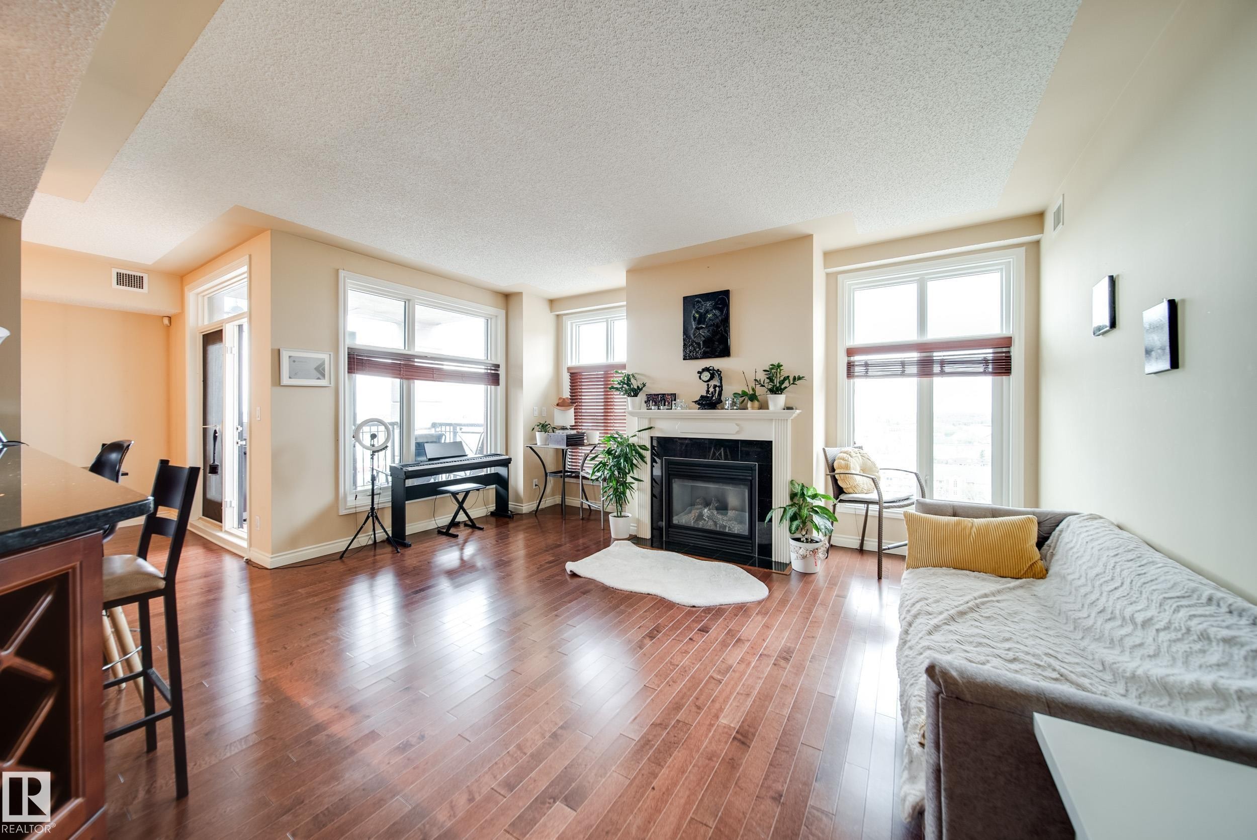 #1301 9020 Jasper Av Nw, Edmonton, AB - Indoor Photo Showing Living Room With Fireplace
