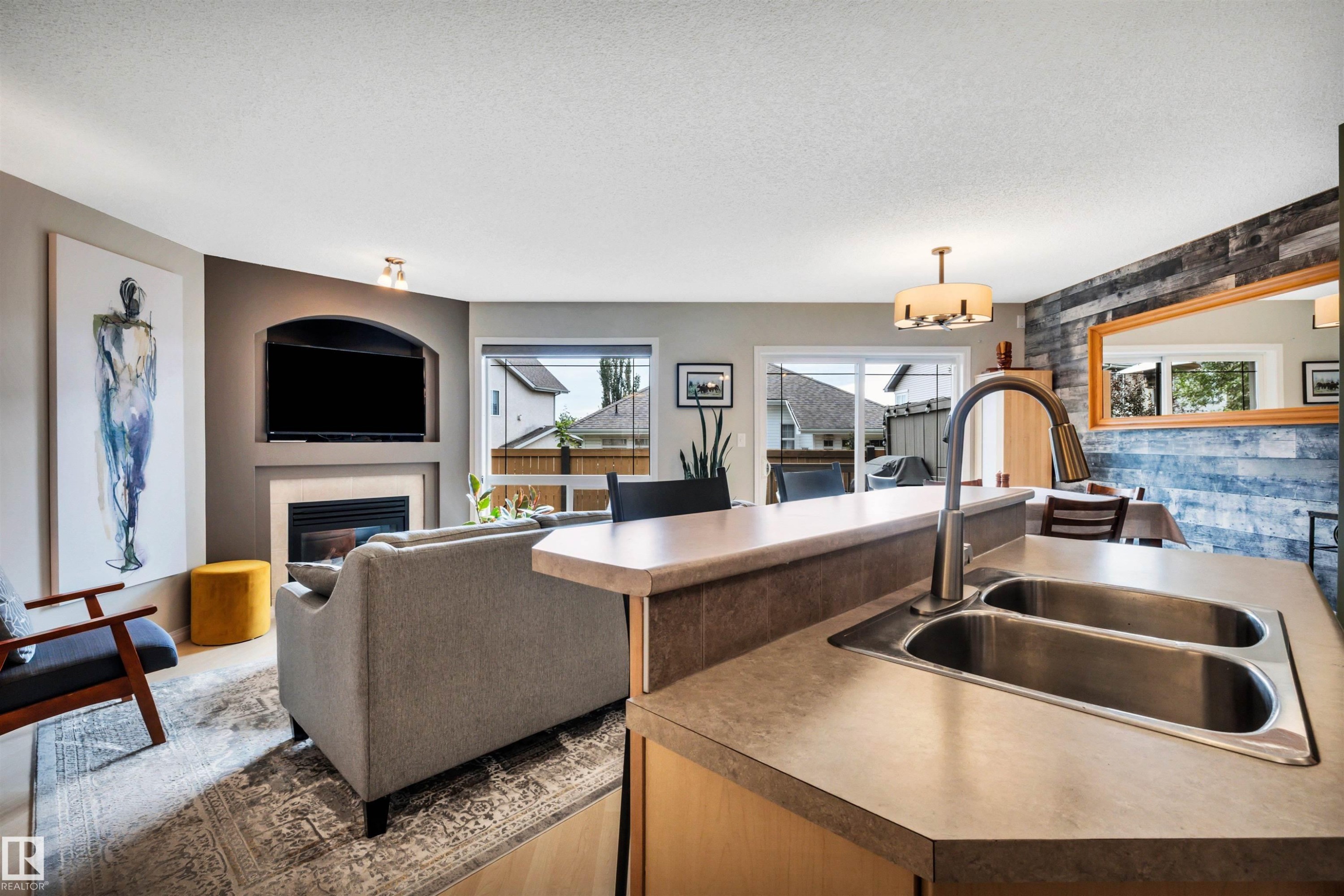 #12 20 Norman Ct, St. Albert, AB - Indoor Photo Showing Kitchen With Fireplace With Double Sink
