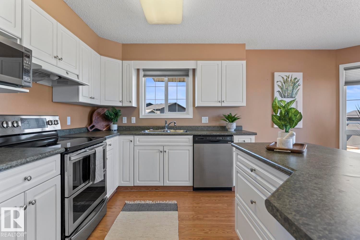 #201 1705 7 Av, Cold Lake, AB - Indoor Photo Showing Kitchen With Stainless Steel Kitchen With Double Sink