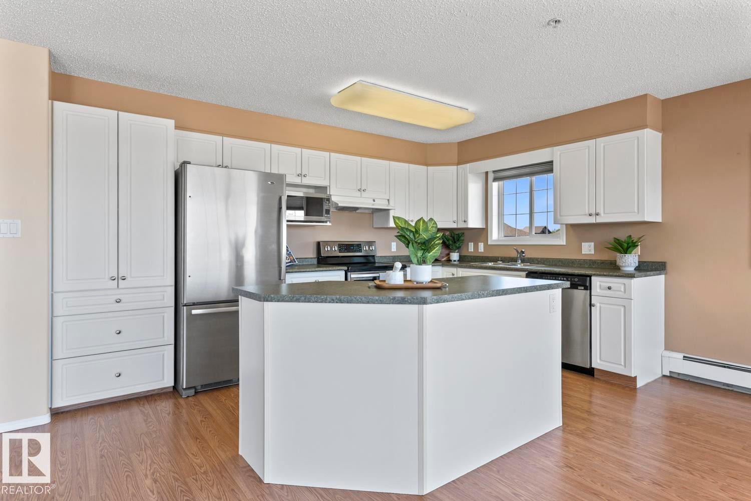 #201 1705 7 Av, Cold Lake, AB - Indoor Photo Showing Kitchen With Stainless Steel Kitchen