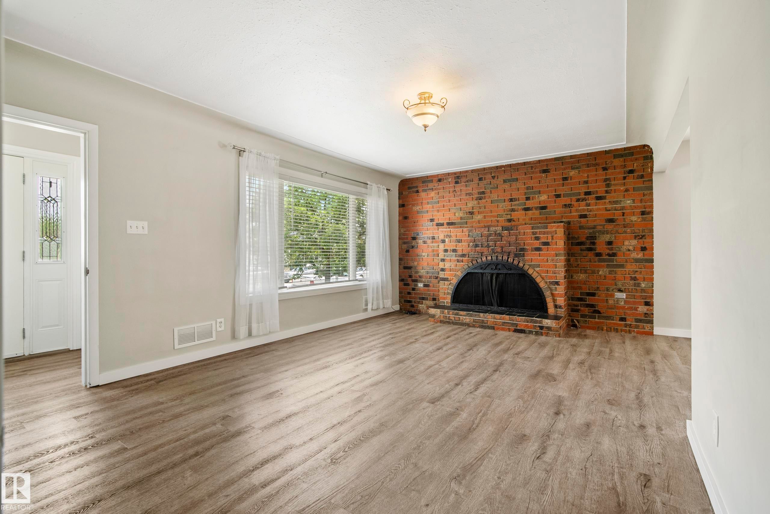 10426 79 Street Nw, Edmonton, AB - Indoor Photo Showing Living Room With Fireplace