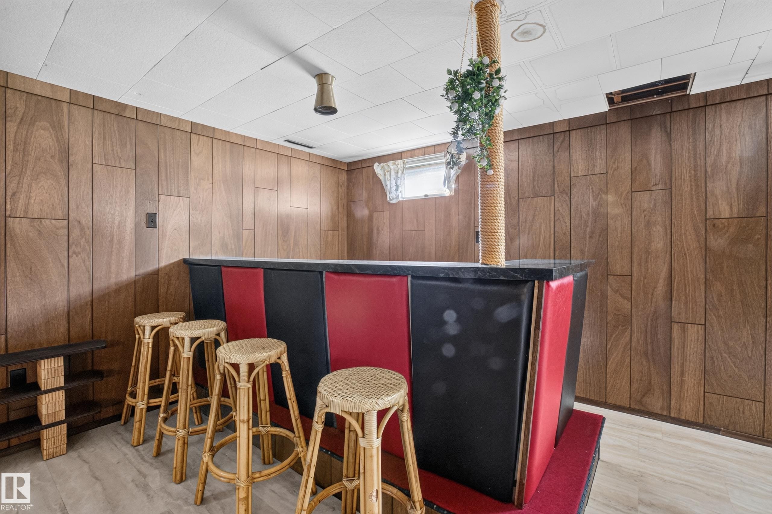 Wood-paneled wall, built-in bar, and suspended ceiling - 16009 93A Avenue Nw, Edmonton, AB - Indoor Photo Showing Other Room