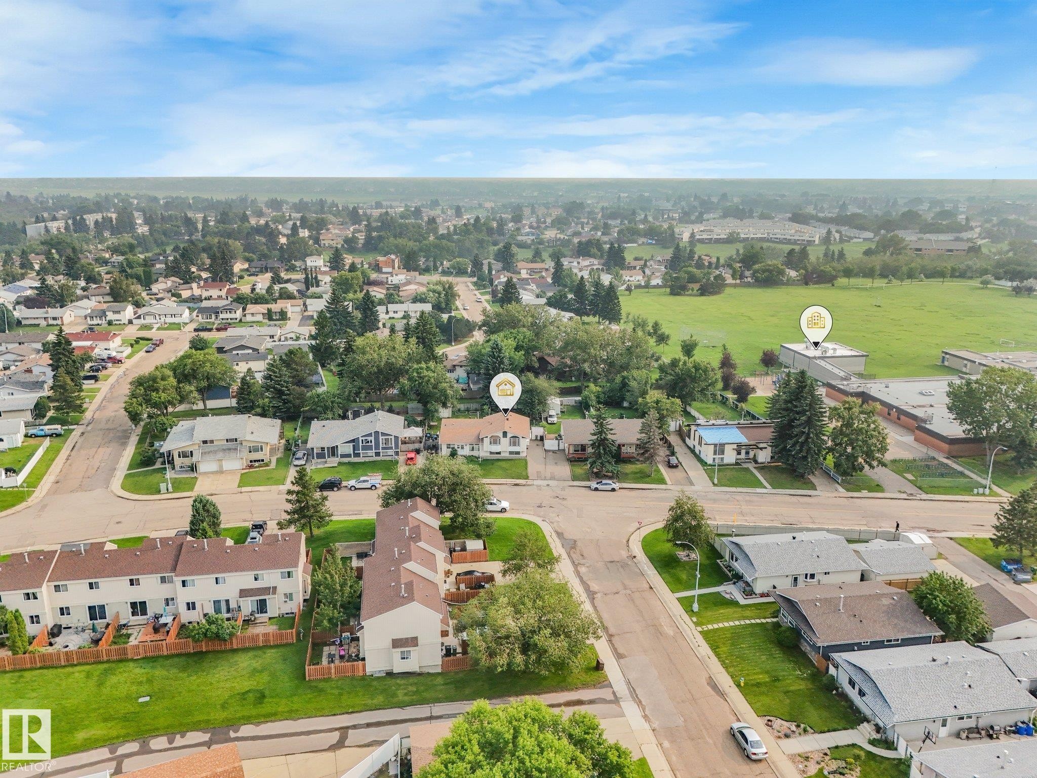 Aerial perspective showcasing a residential neighborhood with a mix of single-family homes and townhomes - 4135 134 Avenue Nw, Edmonton, AB - Outdoor With View