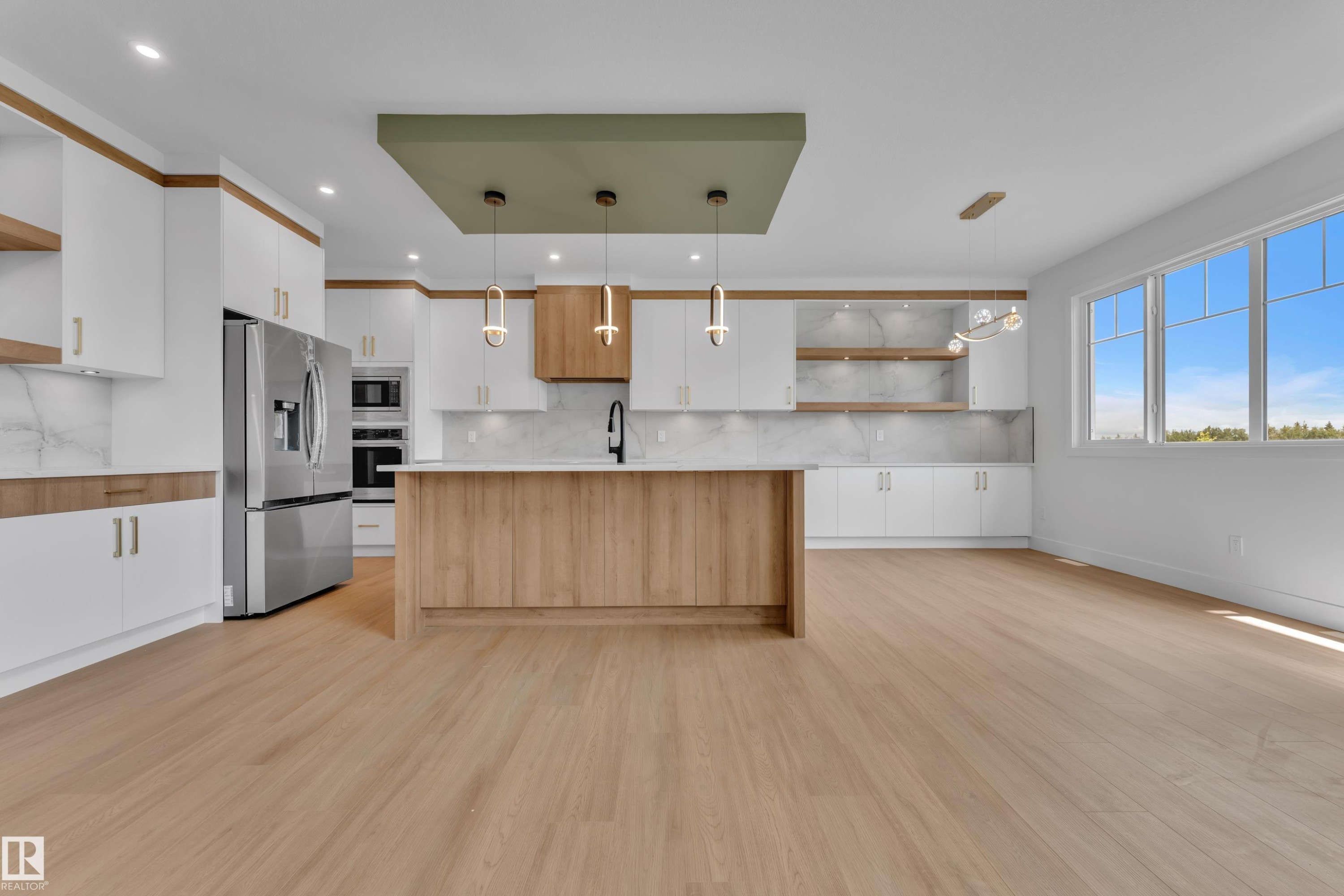 Open-concept living space with light wood-finish flooring - 764 Astoria Way, Devon, AB - Indoor Photo Showing Kitchen