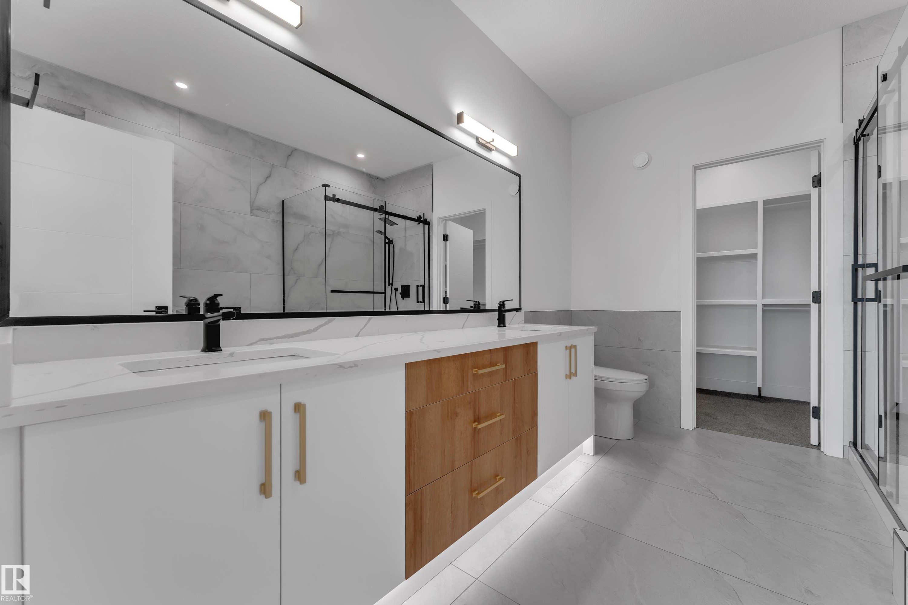 Dual vanity with white cabinetry and wood-finish drawer bank - 764 Astoria Way, Devon, AB - Indoor Photo Showing Bathroom