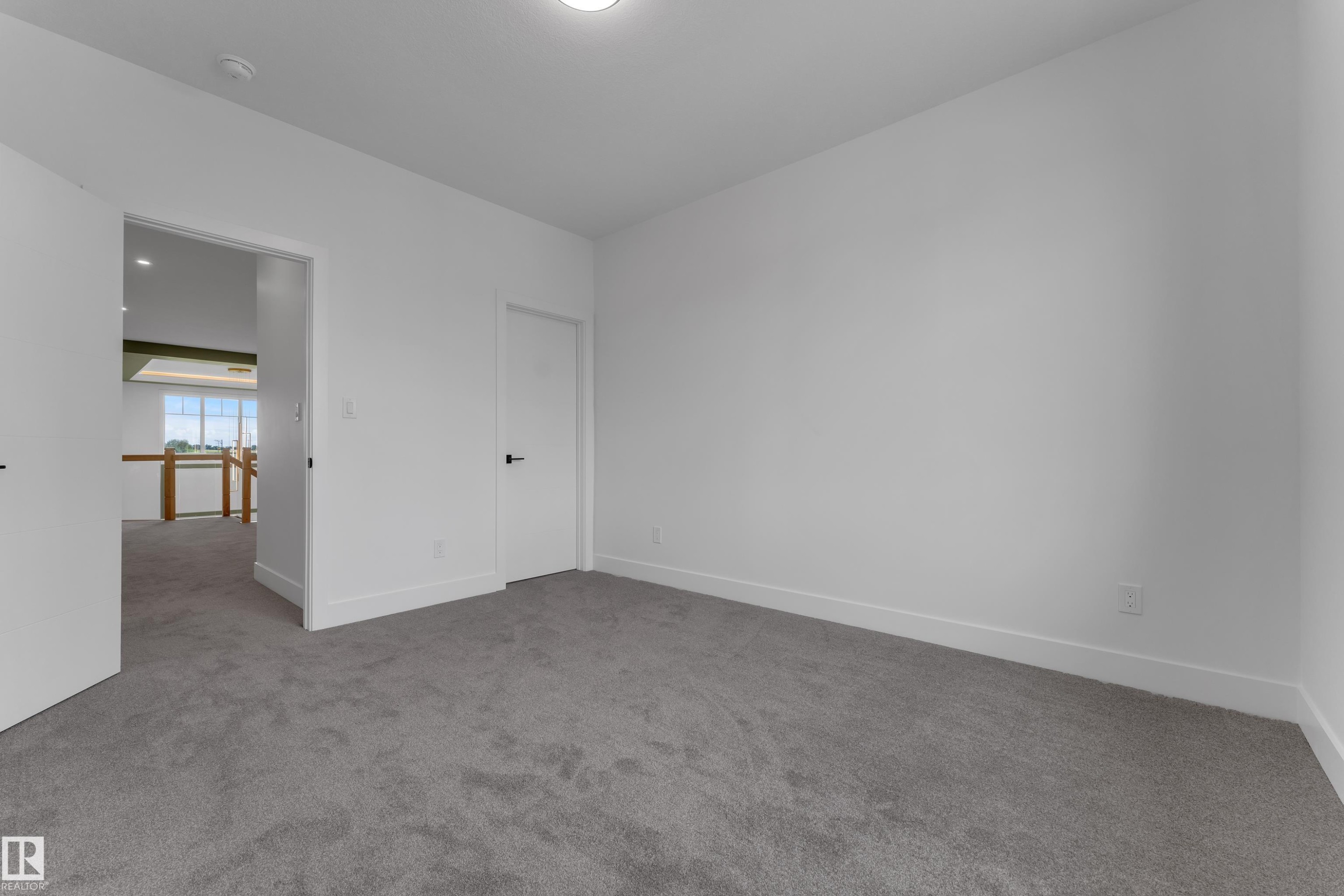 Plush carpeting, white painted walls, and ceiling-mounted lighting - 764 Astoria Way, Devon, AB - Indoor Photo Showing Other Room