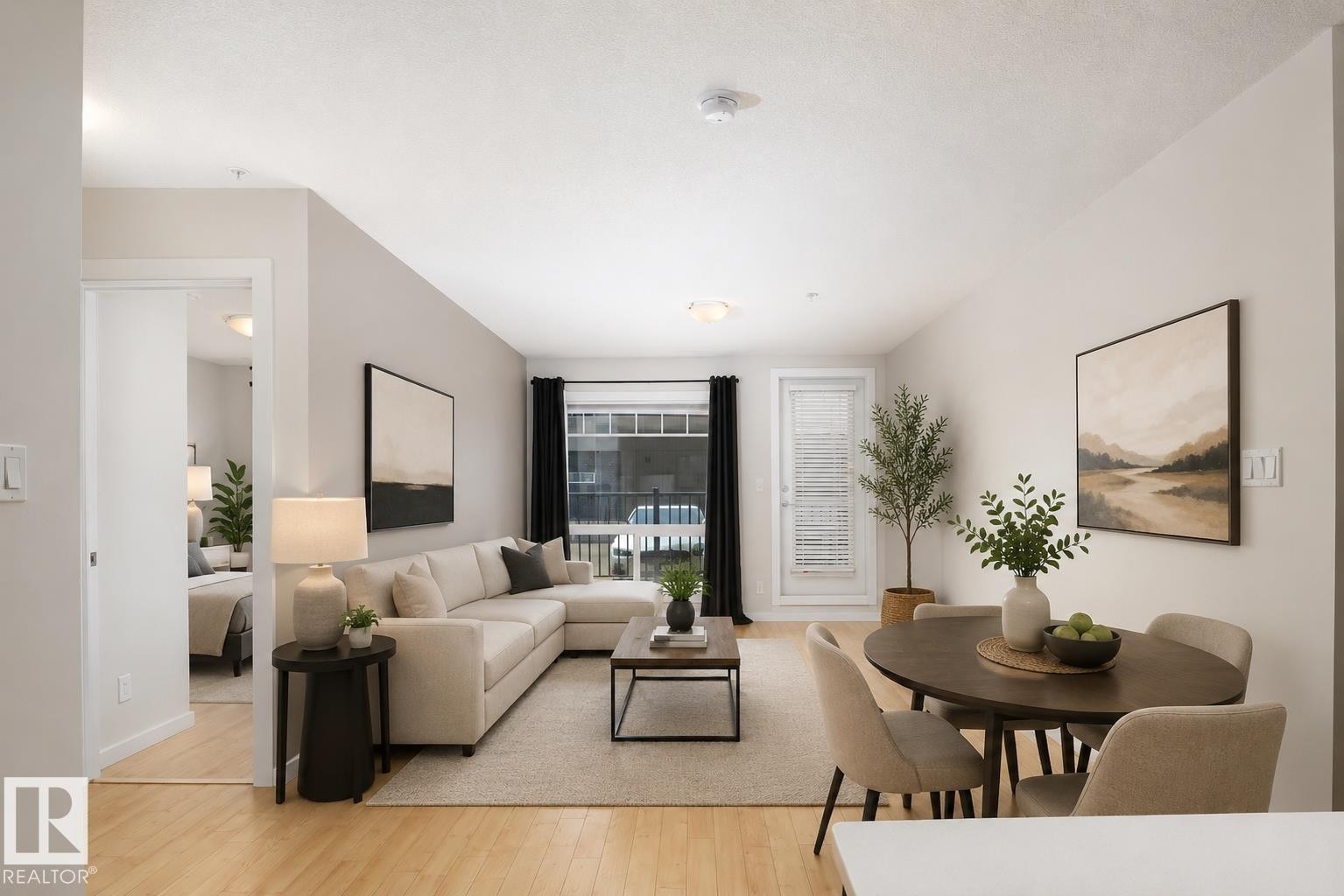 Open-concept living and dining area with light wood-finish flooring, light-toned walls, and a glass-paned door leading to the exterior - #110 9523 160 Av Nw, Edmonton, AB