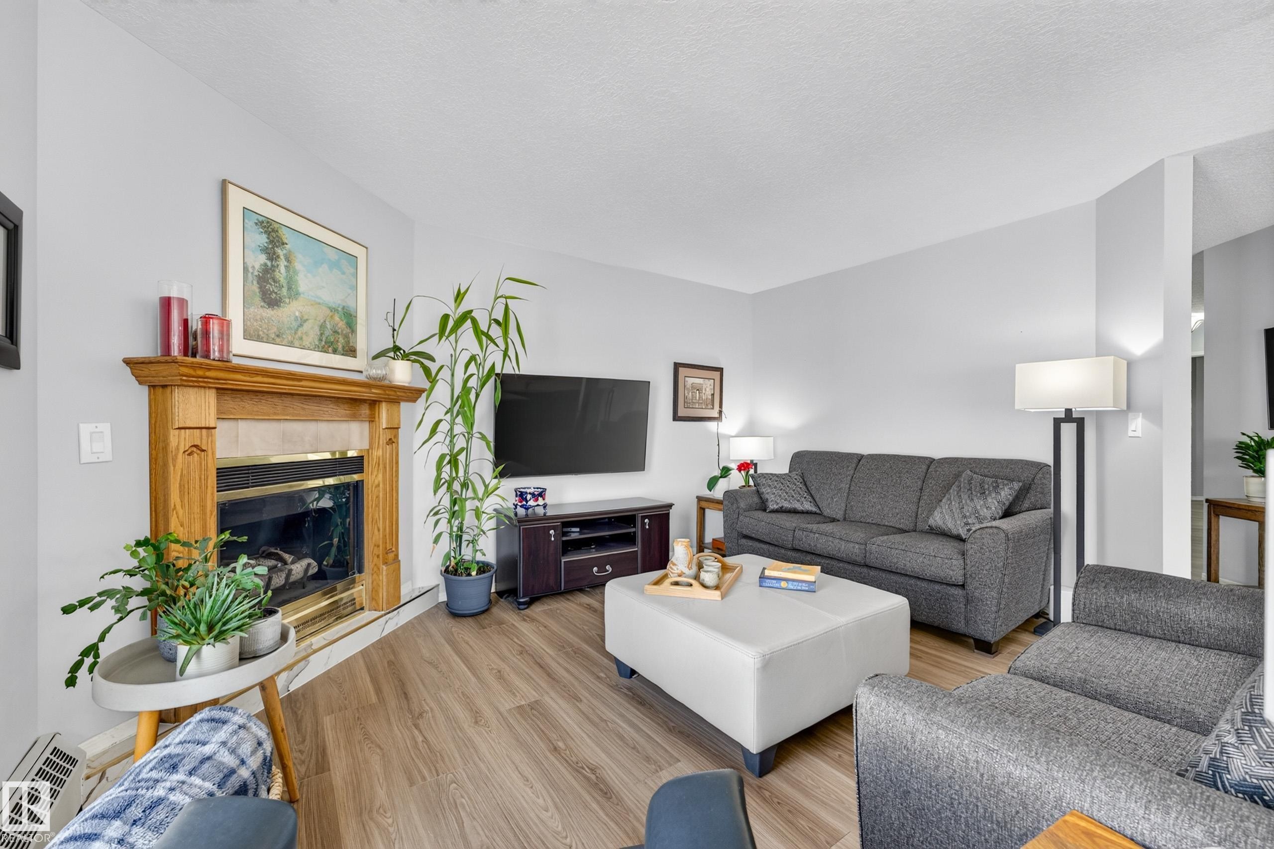 #405 3 Perron St, St. Albert, AB - Indoor Photo Showing Living Room With Fireplace