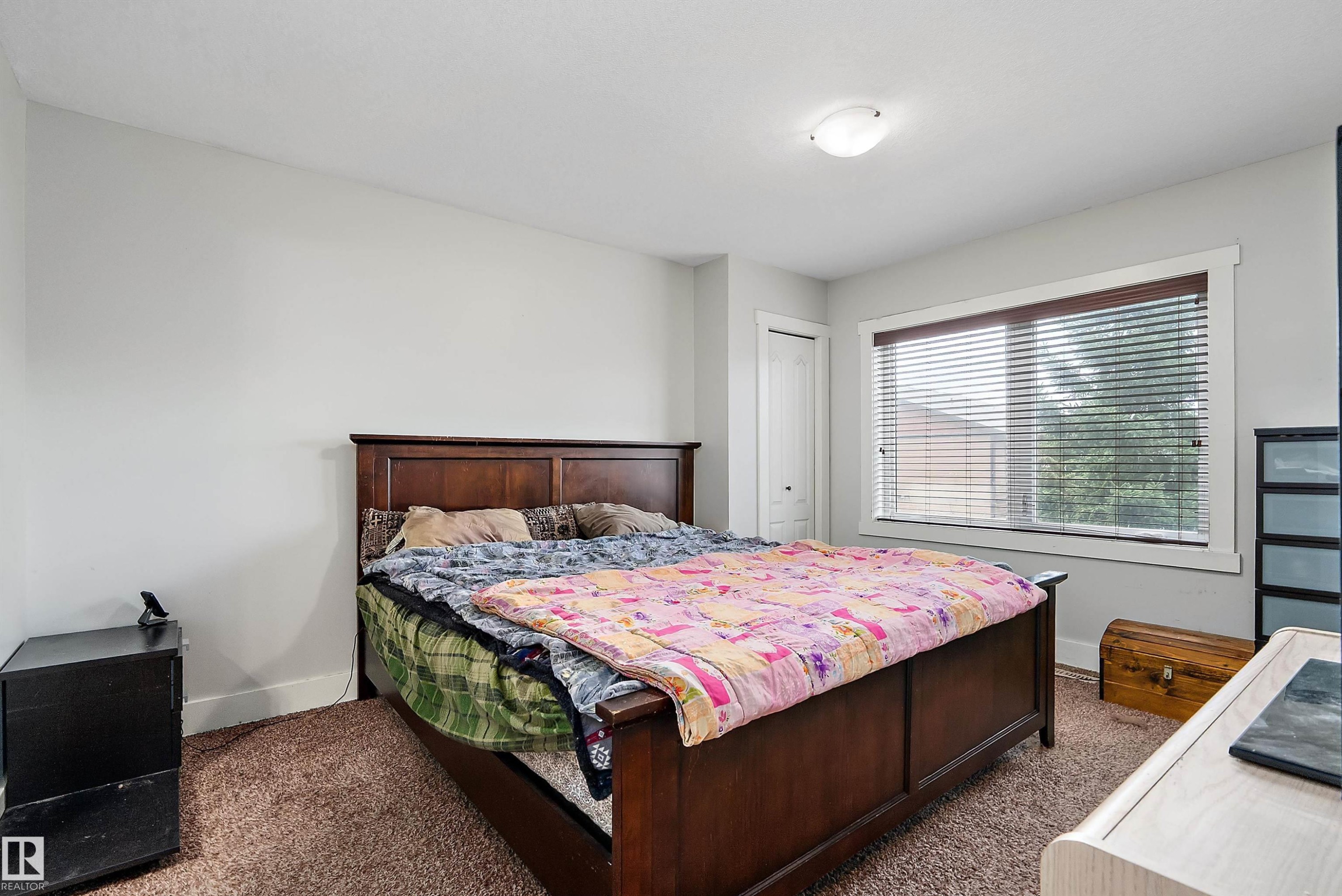 Recessed closet, white window trim, and overhead lighting - 203 Graybriar Green, Stony Plain, AB - Indoor Photo Showing Bedroom