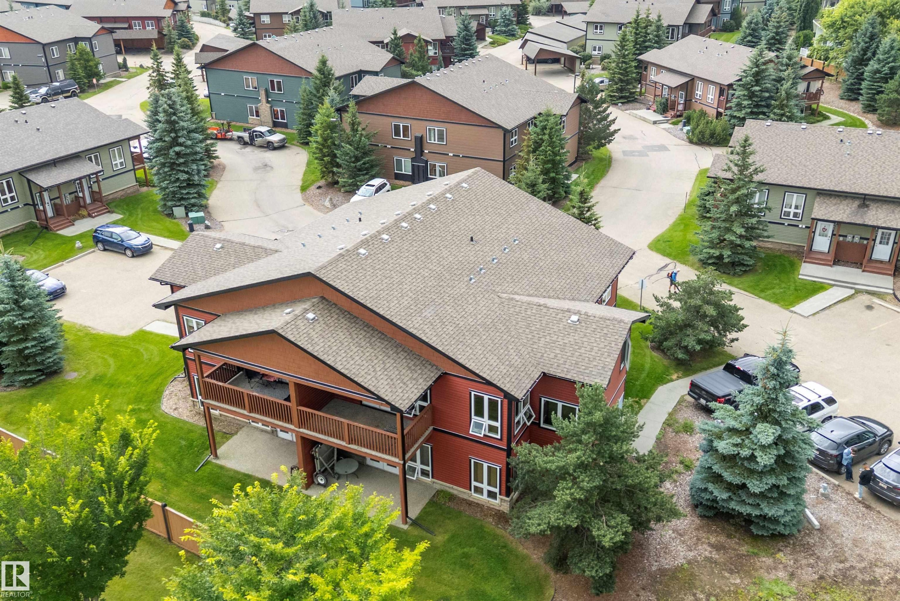 Red-toned exterior with a multi-level deck and covered patio - 203 Graybriar Green, Stony Plain, AB - Outdoor With Deck Patio Veranda