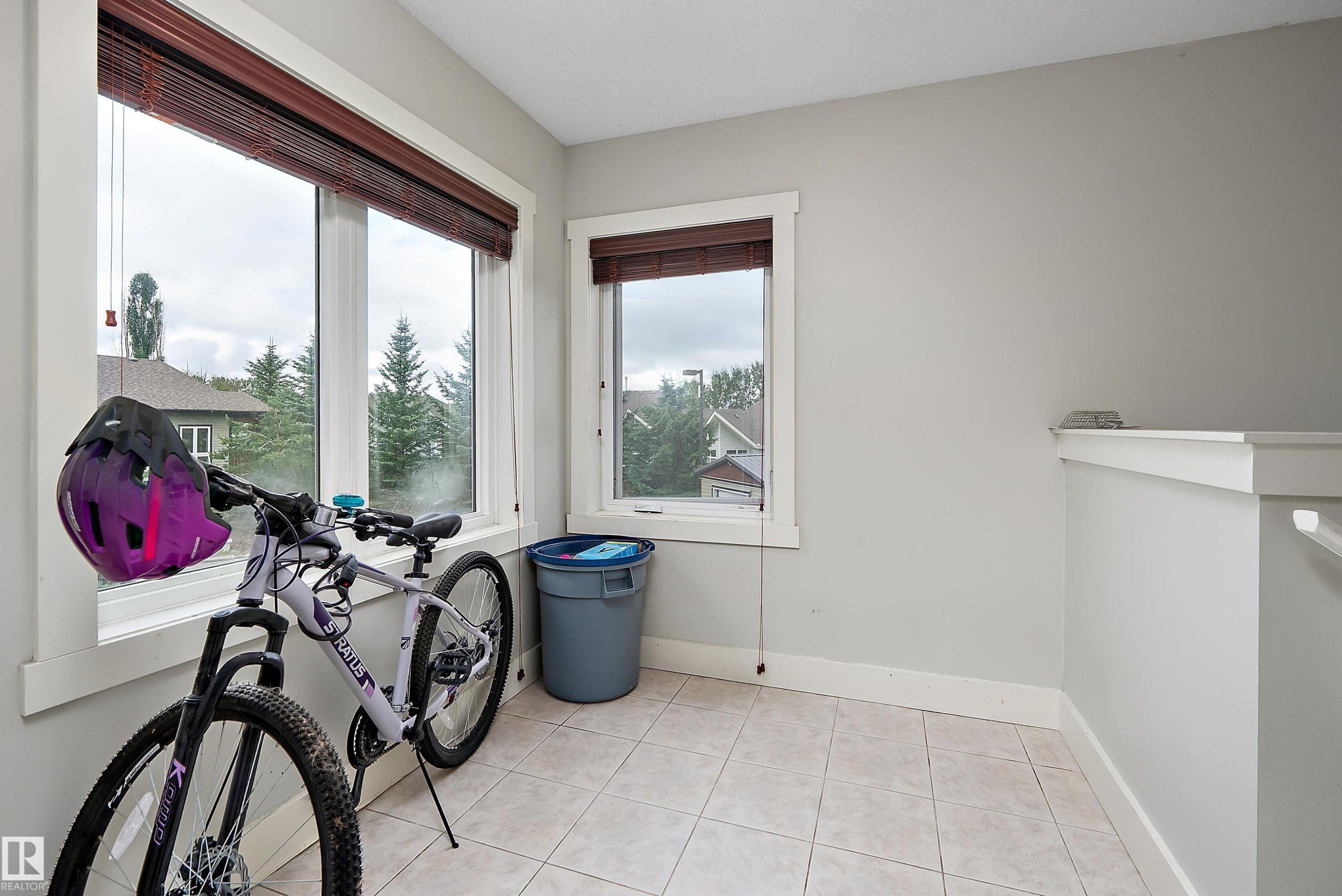 Tile flooring and multiple windows with blinds - 203 Graybriar Green, Stony Plain, AB - Indoor Photo Showing Other Room