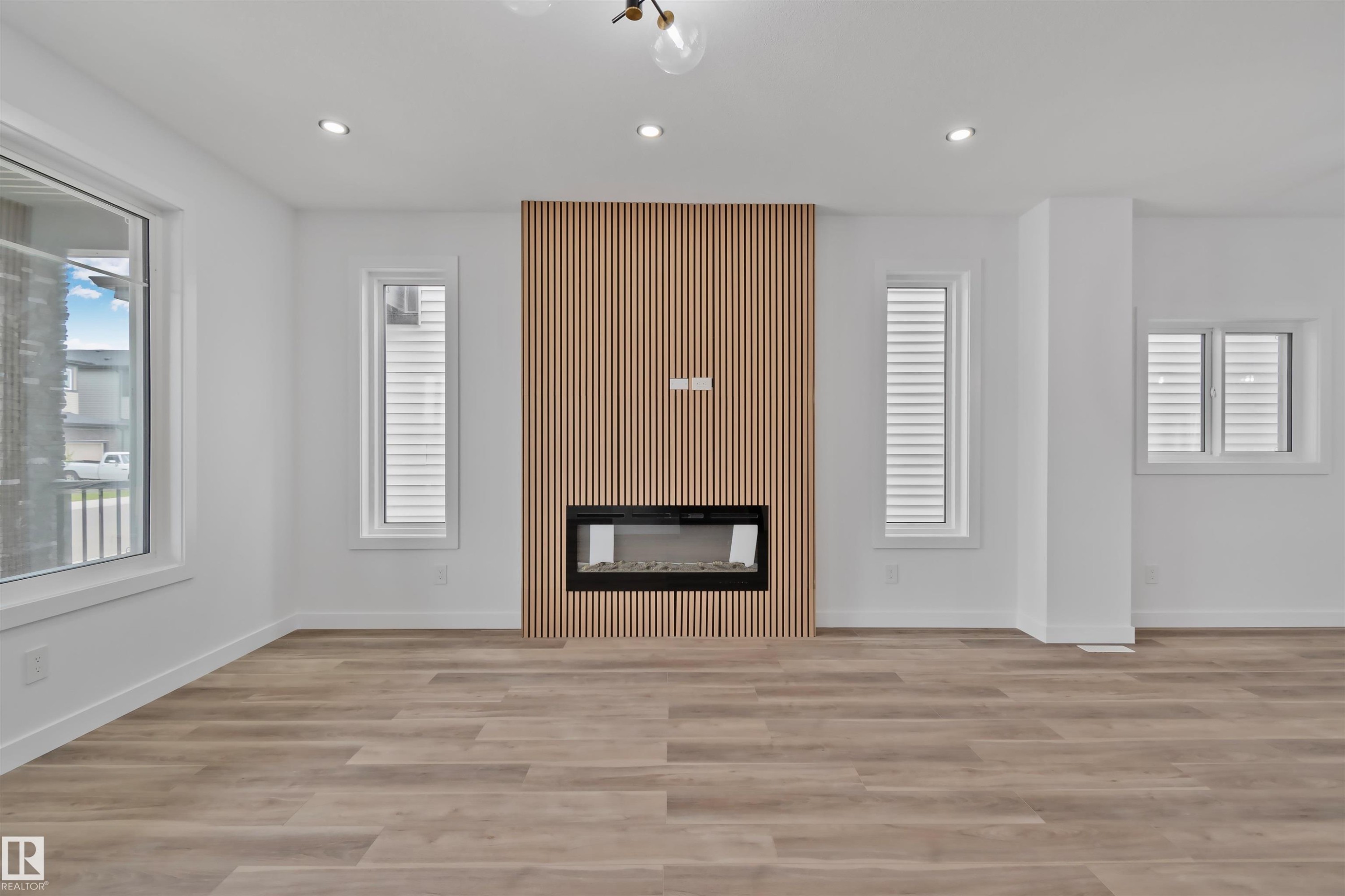 324 Roberts Wynd, Leduc, AB - Indoor Photo Showing Other Room With Fireplace