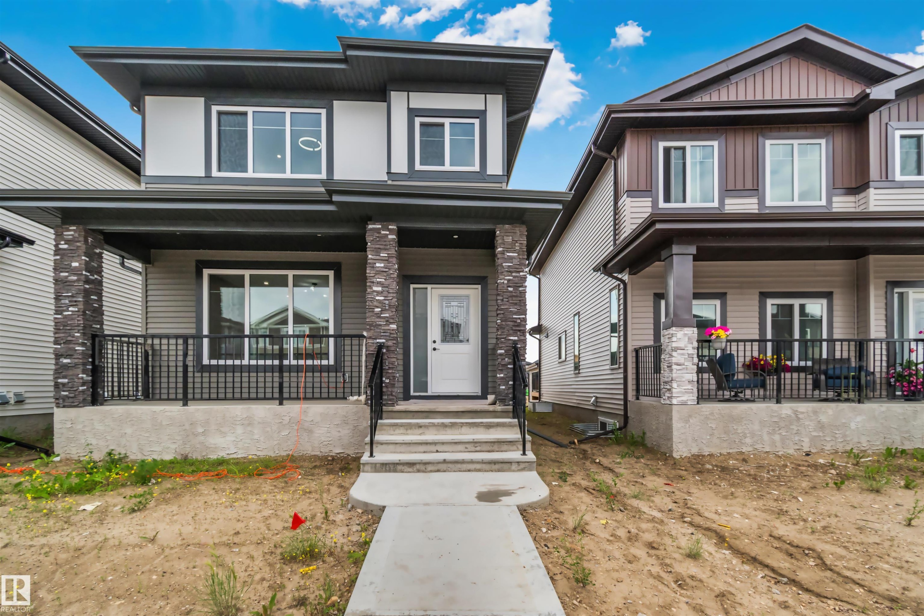 324 Roberts Wynd, Leduc, AB - Outdoor With Deck Patio Veranda With Facade