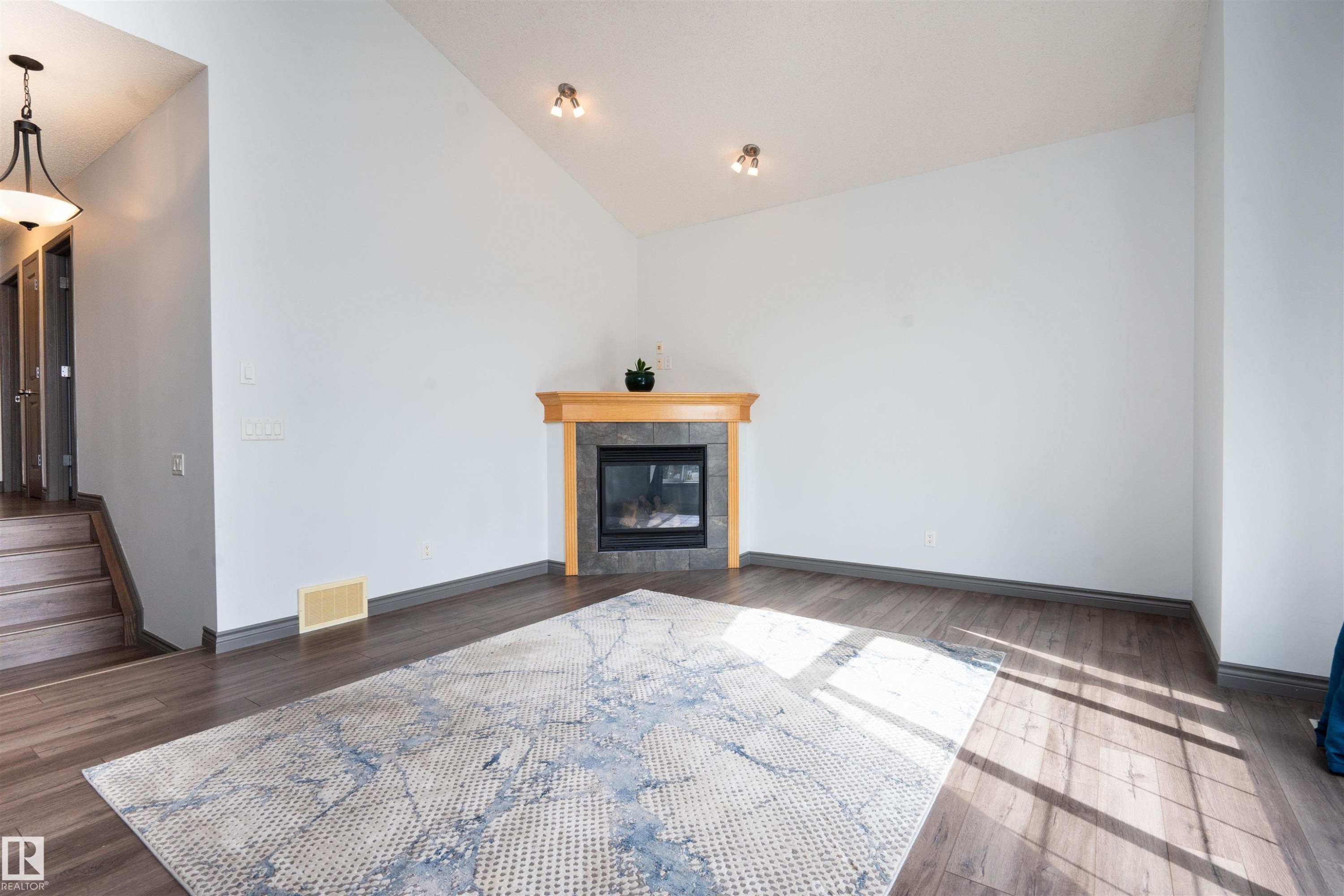 16820 57 Street Nw, Edmonton, AB - Indoor Photo Showing Living Room With Fireplace