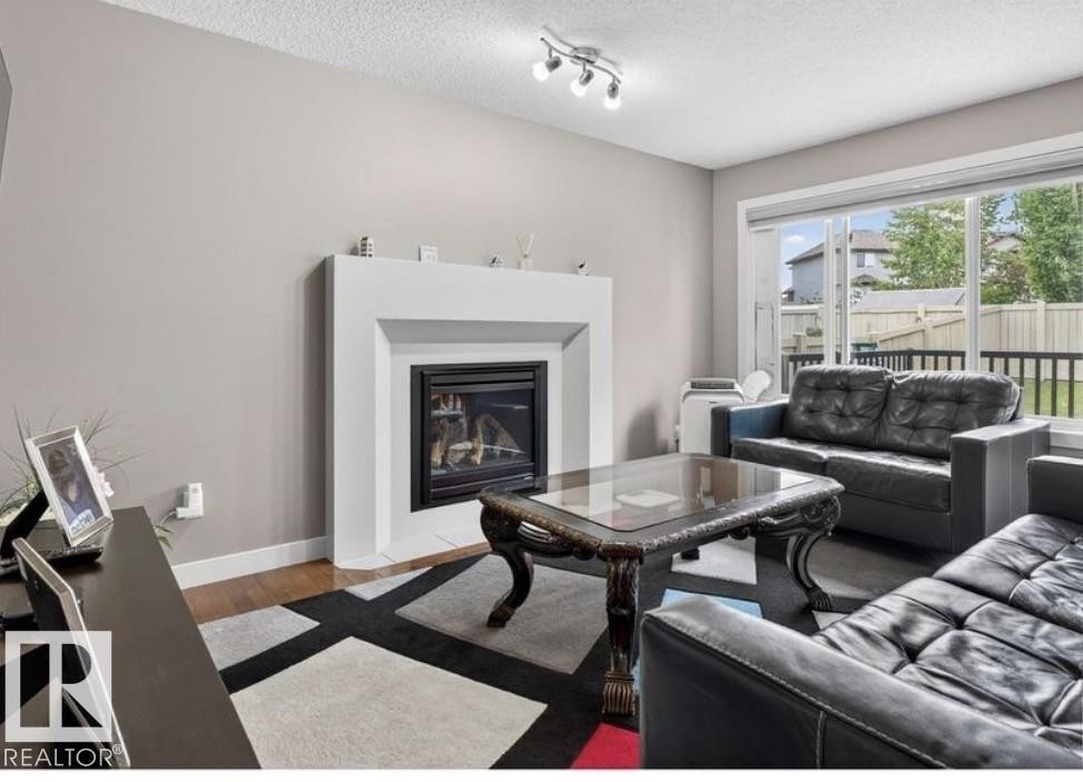6811 19 Avenue Sw, Edmonton, AB - Indoor Photo Showing Living Room With Fireplace