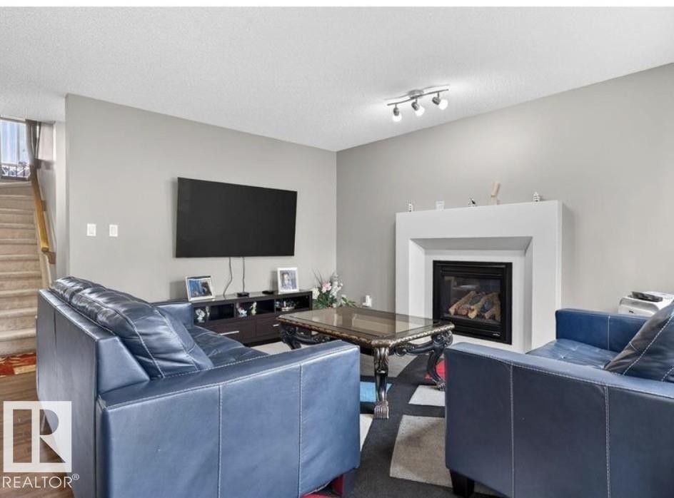 6811 19 Avenue Sw, Edmonton, AB - Indoor Photo Showing Living Room With Fireplace