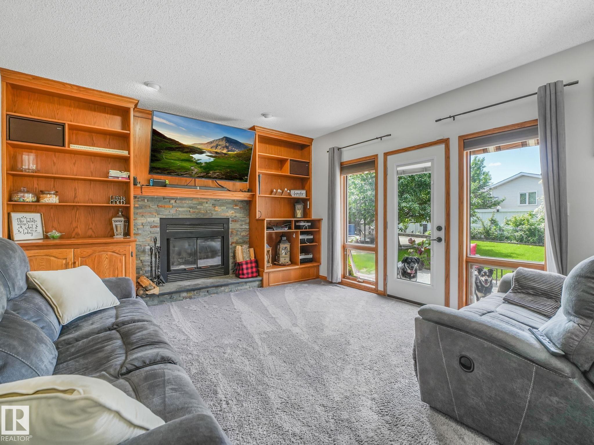 2824 37 Street Nw, Edmonton, AB - Indoor Photo Showing Living Room With Fireplace