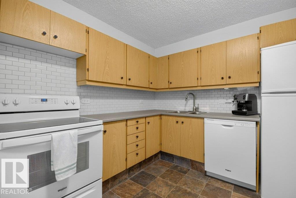 #804 11027 87 Av Nw, Edmonton, AB - Indoor Photo Showing Kitchen With Double Sink