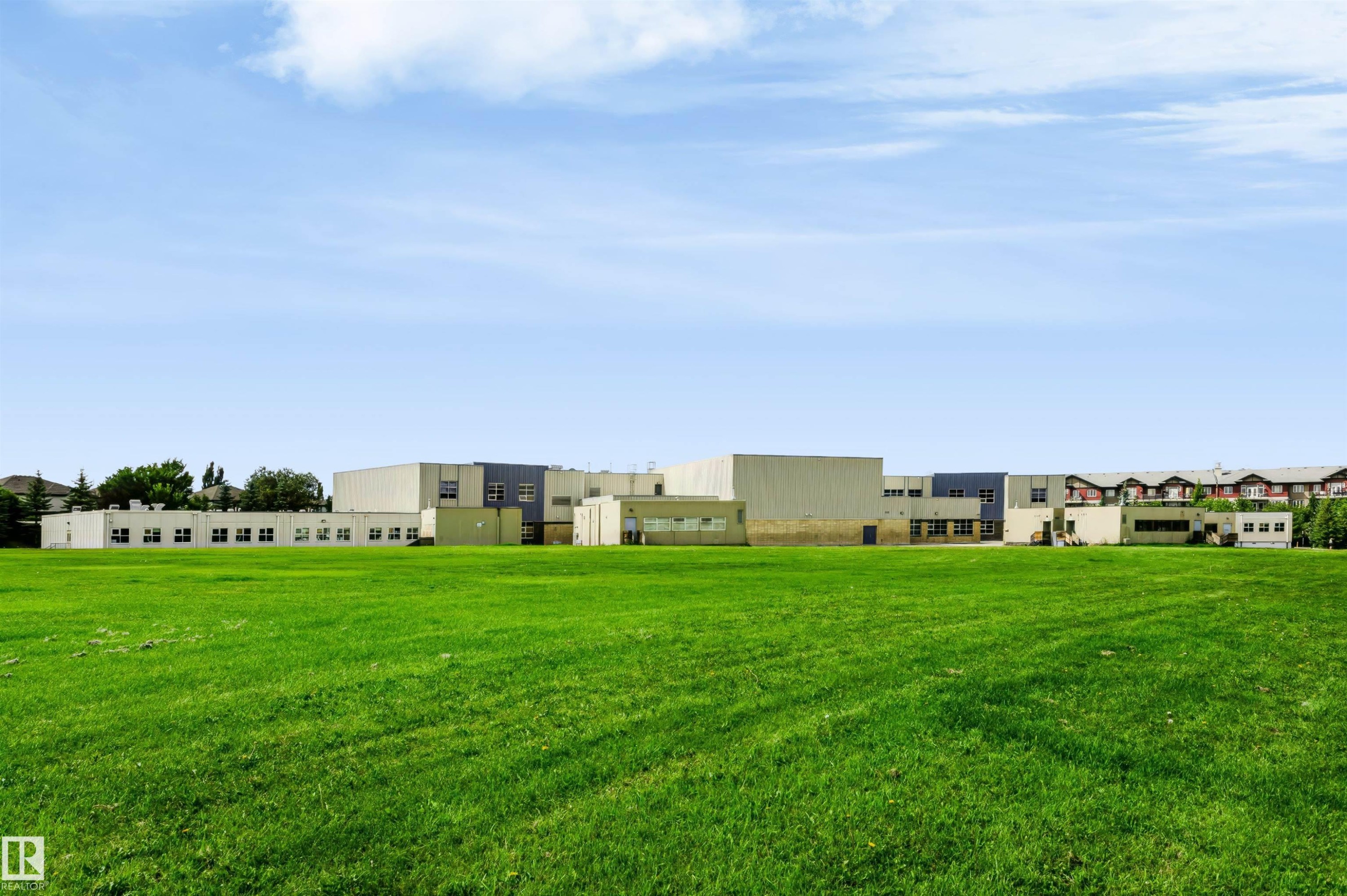 Expansive green space with distant multi-story structures - 1720 Robertson Place Sw, Edmonton, AB - Outdoor