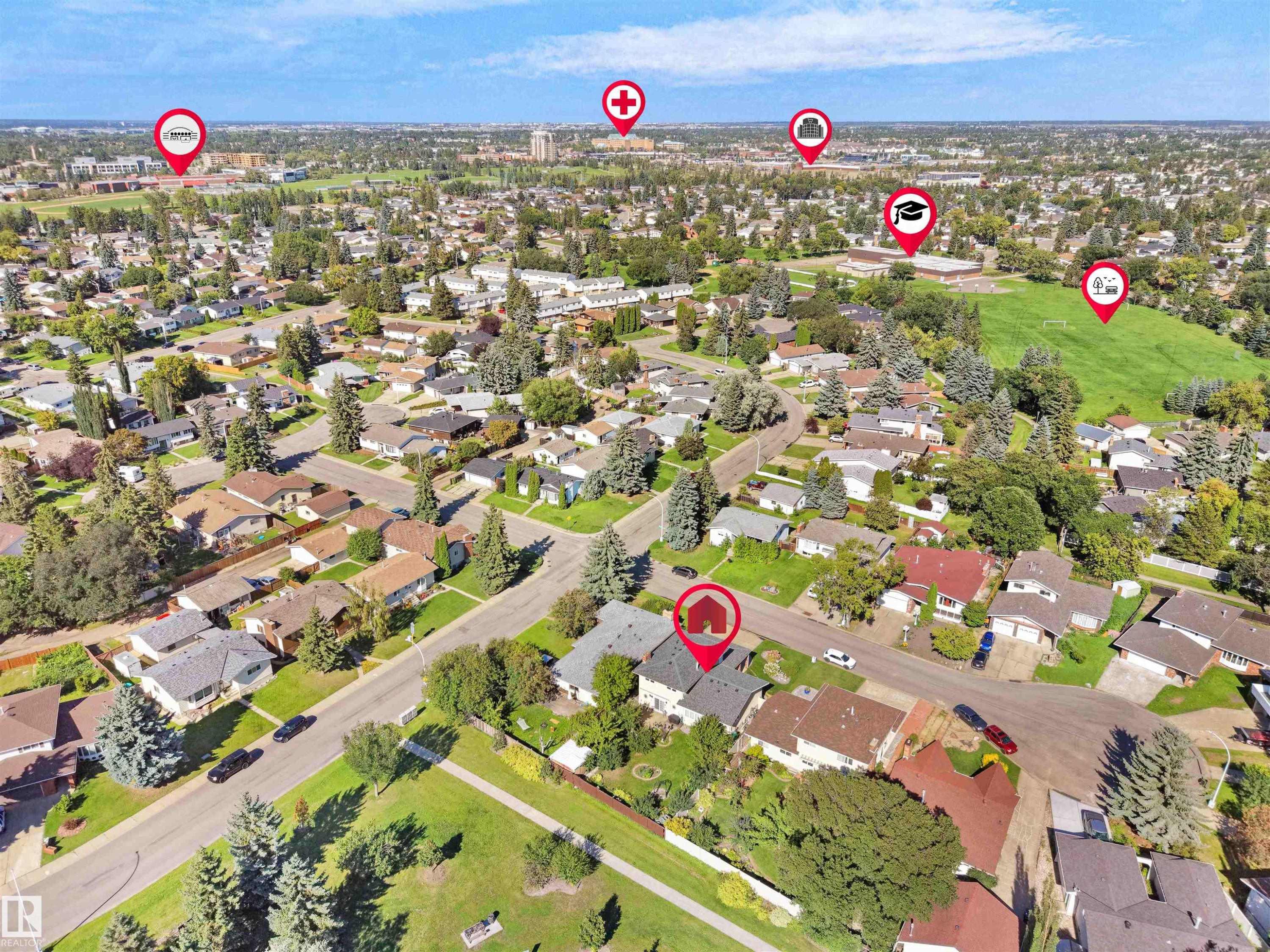 Aerial perspective of a residential neighborhood featuring established homes, mature trees, and green spaces - 7357 18 Avenue Nw, Edmonton, AB - Outdoor With View