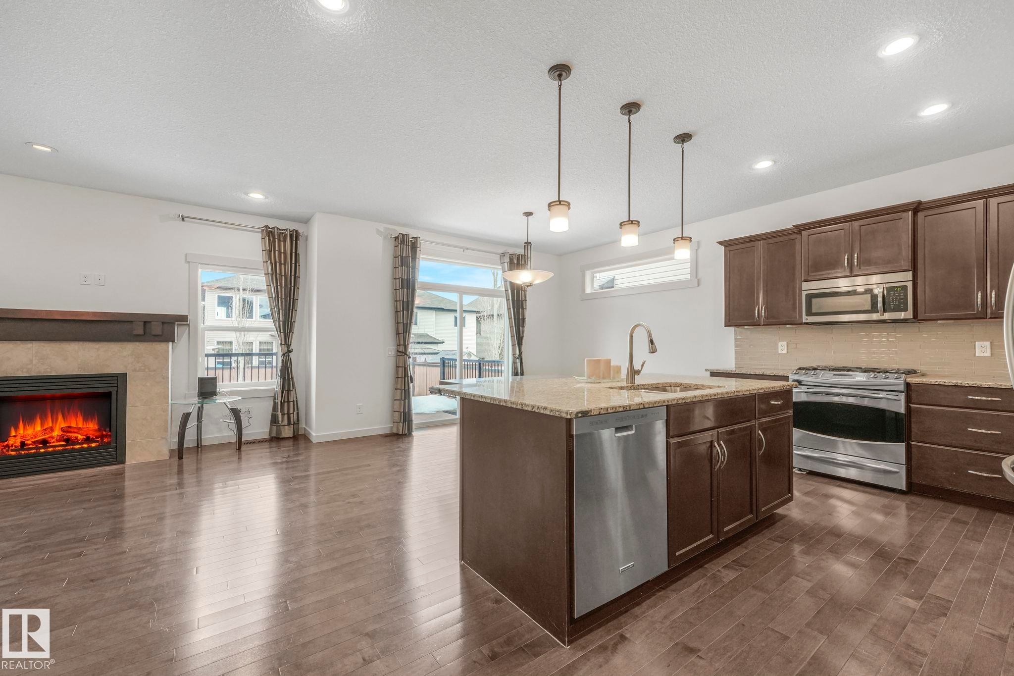 1548 36 Avenue Nw, Edmonton, AB - Indoor Photo Showing Kitchen With Fireplace With Stainless Steel Kitchen With Upgraded Kitchen