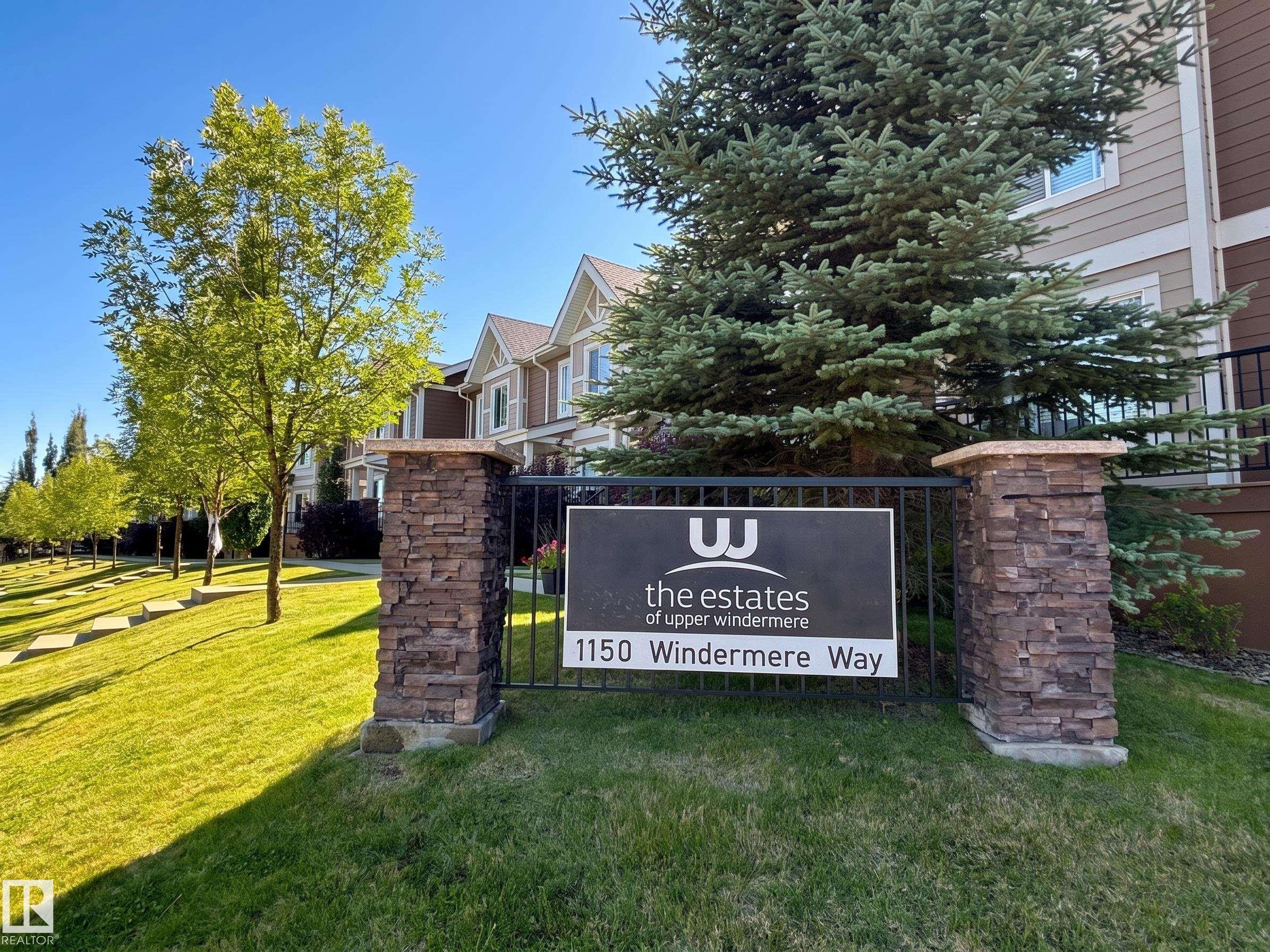 Stone-clad pillars with metal fencing - #29 1150 Windermere Wy Sw, Edmonton, AB