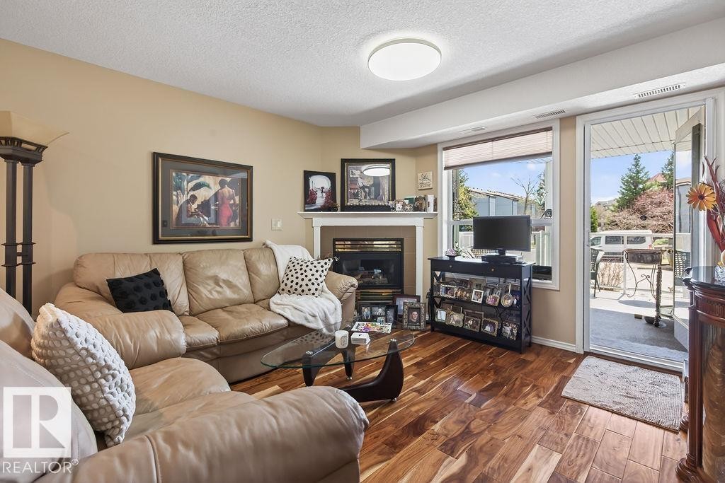 #112 6703 172 St Nw, Edmonton, AB - Indoor Photo Showing Living Room With Fireplace
