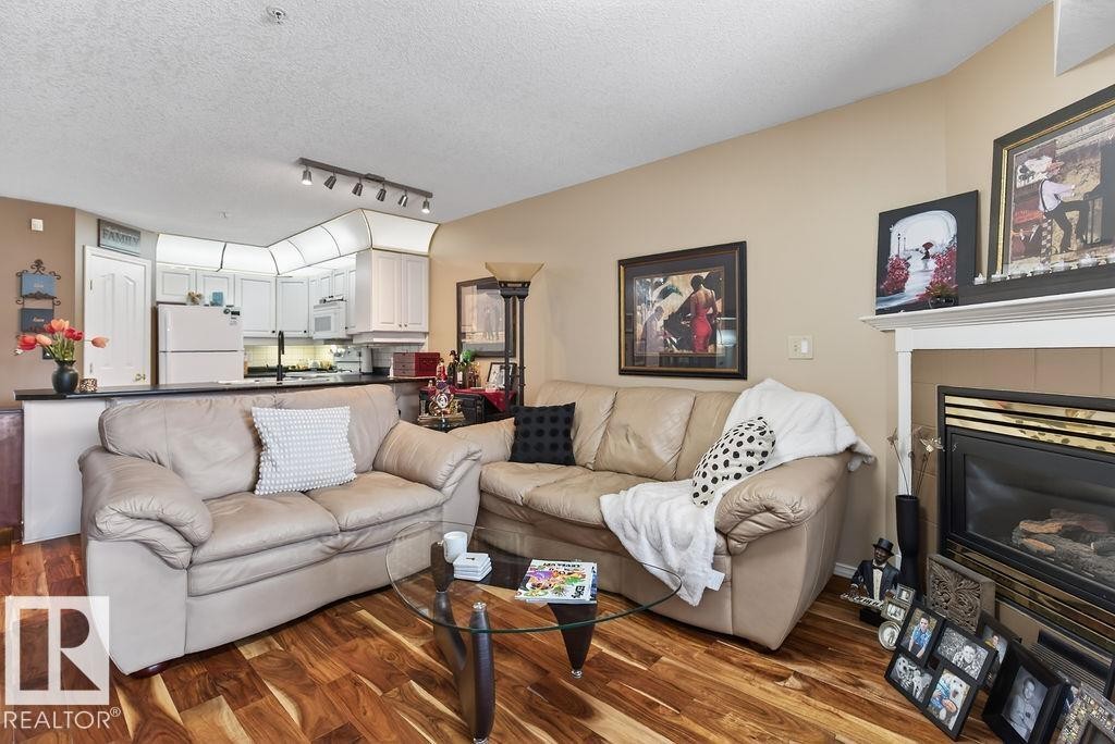 #112 6703 172 St Nw, Edmonton, AB - Indoor Photo Showing Living Room With Fireplace