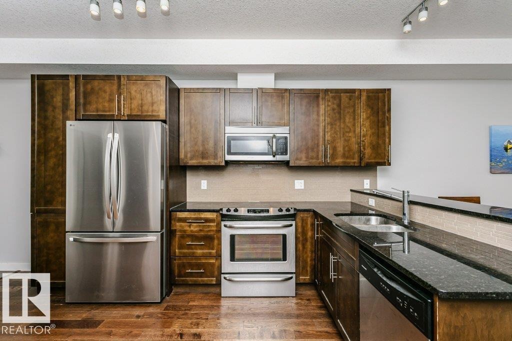 #209 10811 72 Av Nw, Edmonton, AB - Indoor Photo Showing Kitchen With Stainless Steel Kitchen With Double Sink