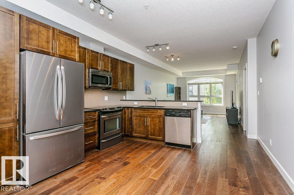 #209 10811 72 Av Nw, Edmonton, AB - Indoor Photo Showing Kitchen With Stainless Steel Kitchen