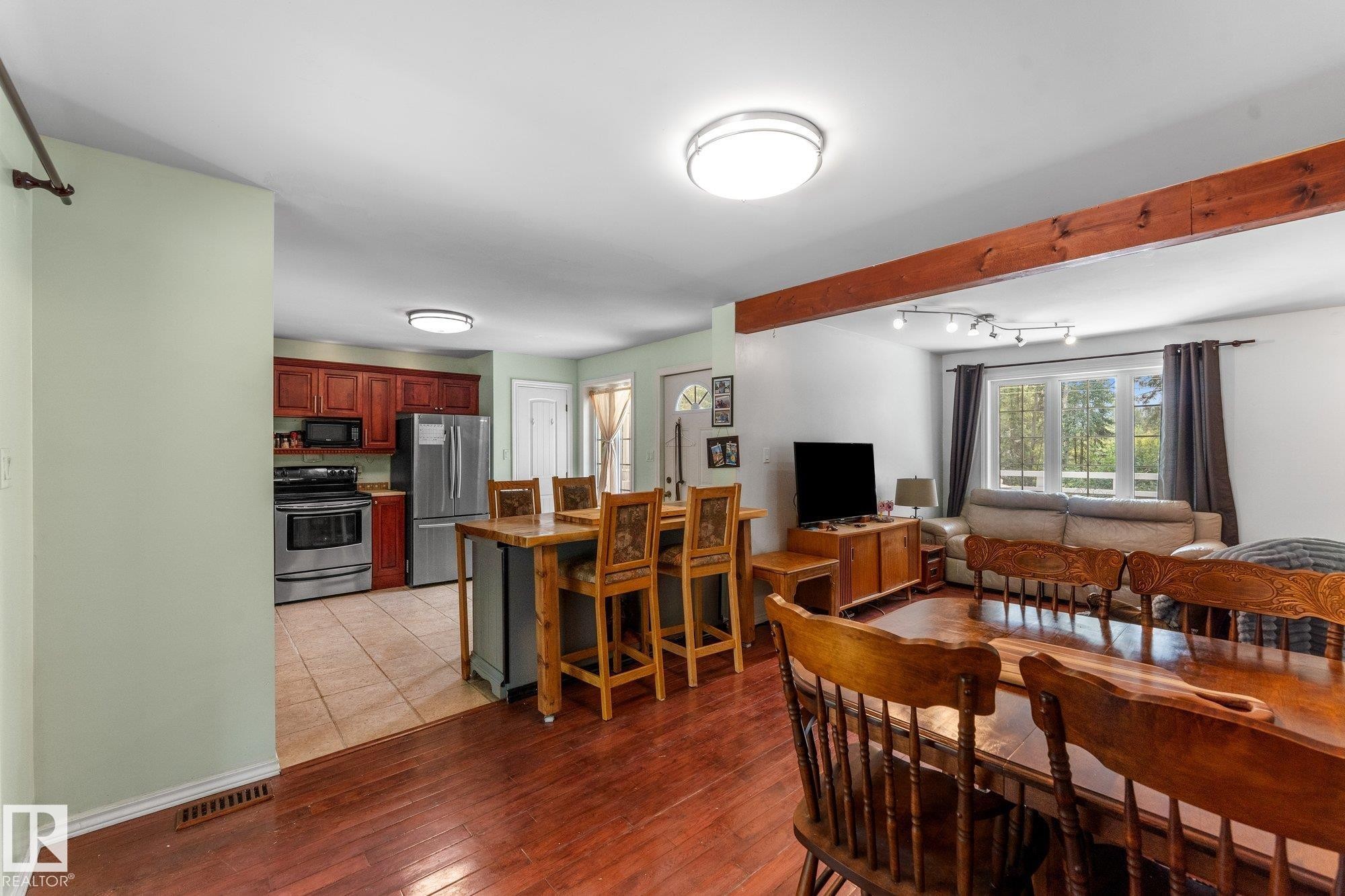 Kitchen with wood cabinetry and stainless steel appliances - 2, 59031 Range Rd 232, Rural Thorhild County, AB - Indoor Photo Showing Dining Room