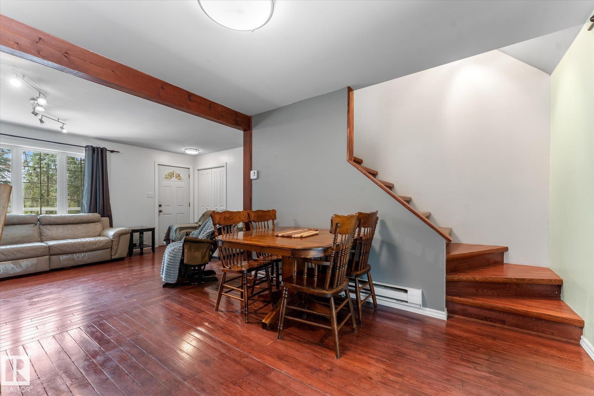 Wood staircase leads to upper level in floor noted as Primary suite, but can use as flex area or shared bedroom space - 2, 59031 Range Rd 232, Rural Thorhild County, AB - Indoor