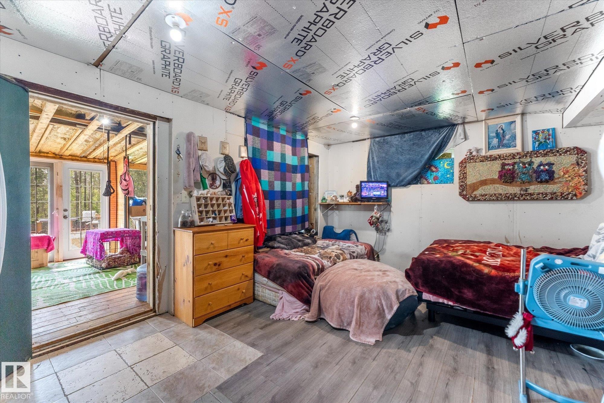 area off the lower main entry - through the sunroom to the area set aside currently as a sleeping space - 2, 59031 Range Rd 232, Rural Thorhild County, AB - Indoor