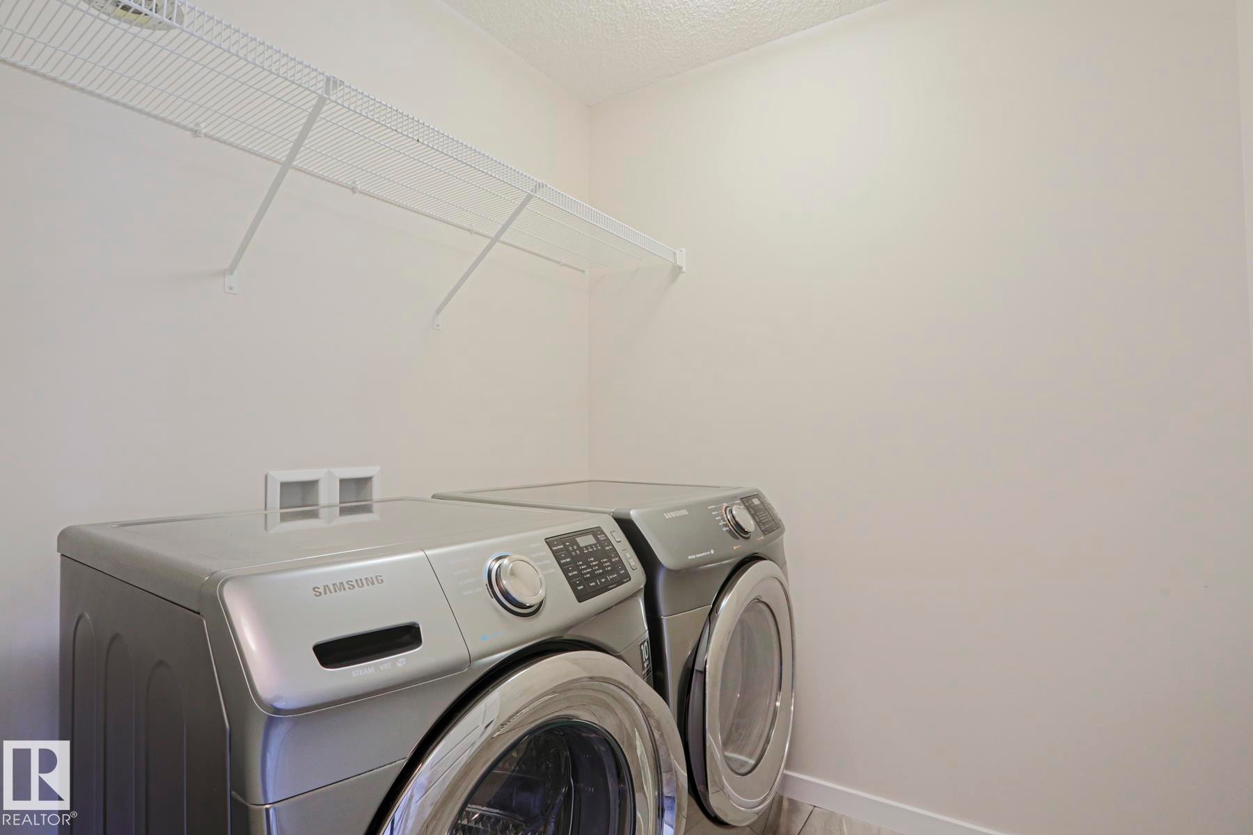 Laundry area featuring a wire storage shelf - 308 Watt Boulevard Sw, Edmonton, AB - Indoor Photo Showing Laundry Room