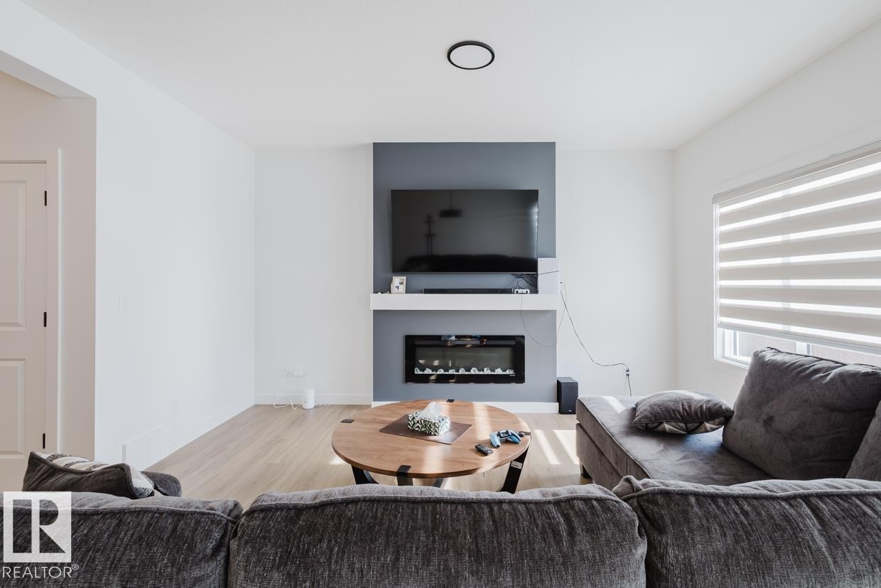 6411 27 Avenue Sw, Edmonton, AB - Indoor Photo Showing Living Room With Fireplace