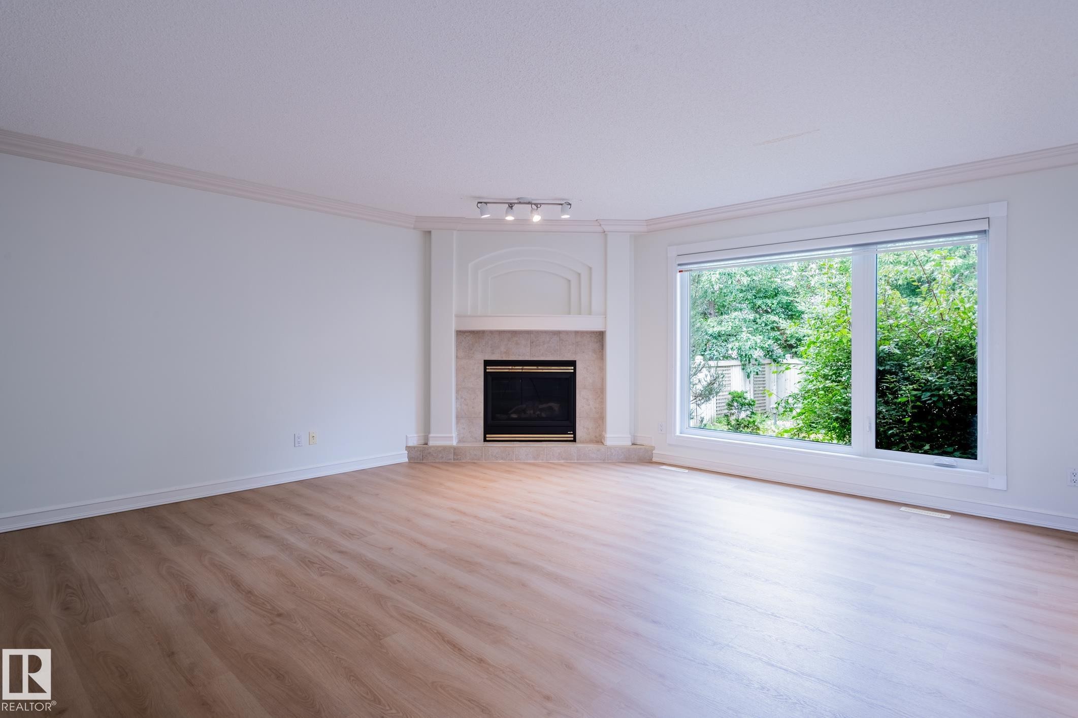 310 Livingstone Court Nw, Edmonton, AB - Indoor Photo Showing Living Room With Fireplace