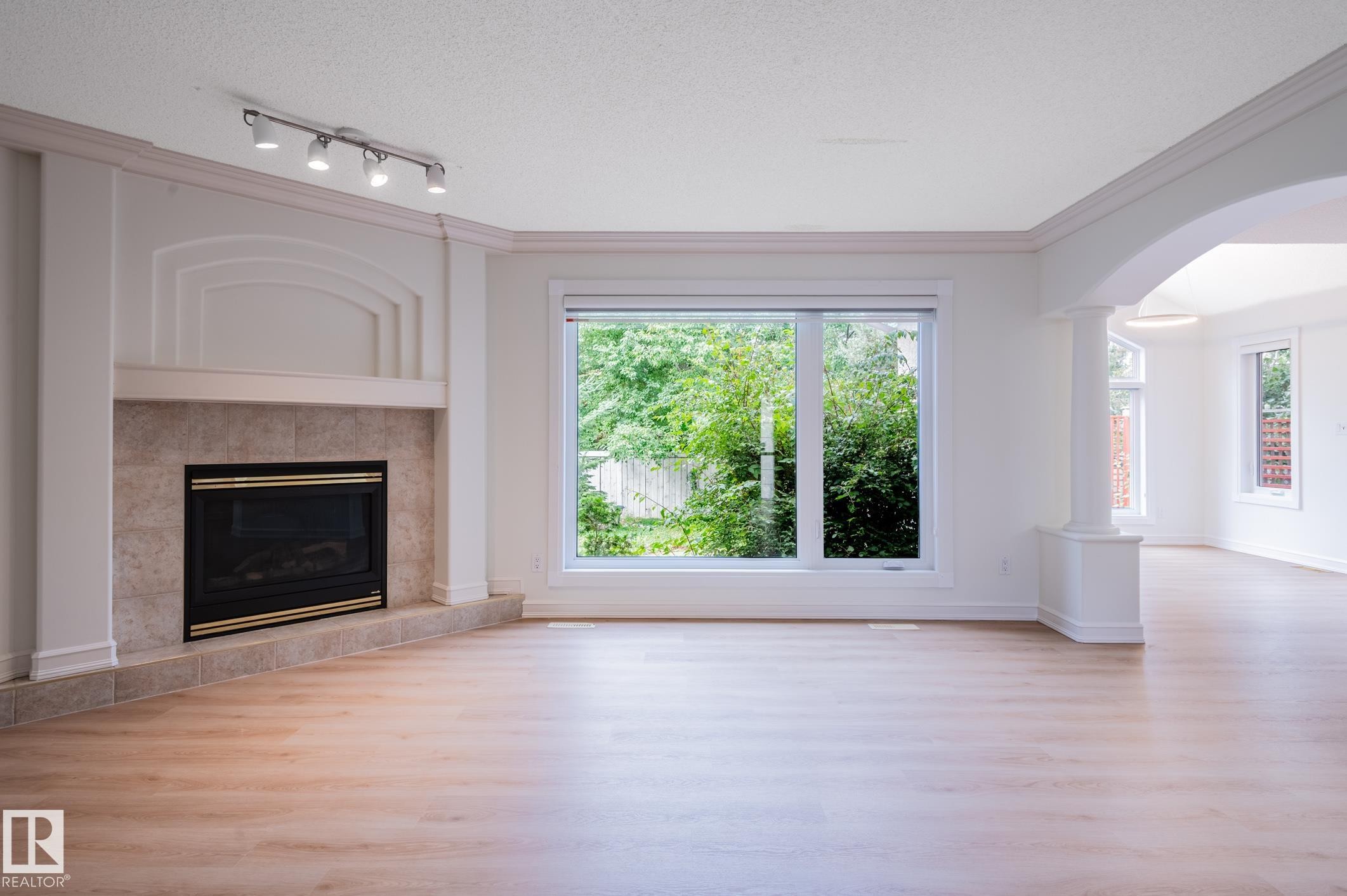 310 Livingstone Court Nw, Edmonton, AB - Indoor Photo Showing Living Room With Fireplace
