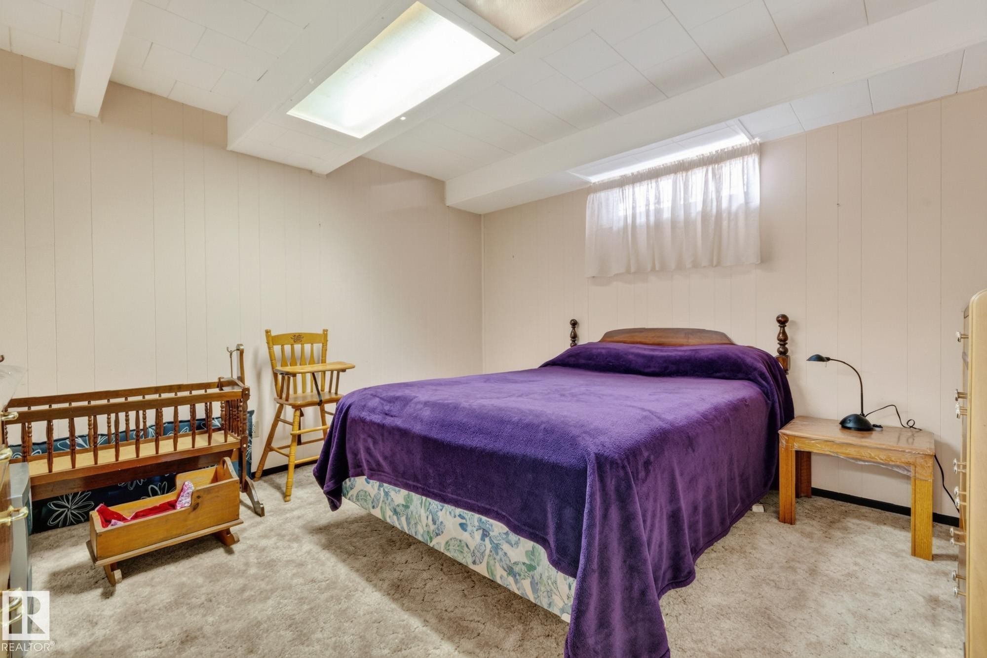 Recessed ceiling lighting, exposed ceiling beams, paneled wall finish, window with white curtain, and carpeted flooring - 13432 134 Street Nw, Edmonton, AB - Indoor