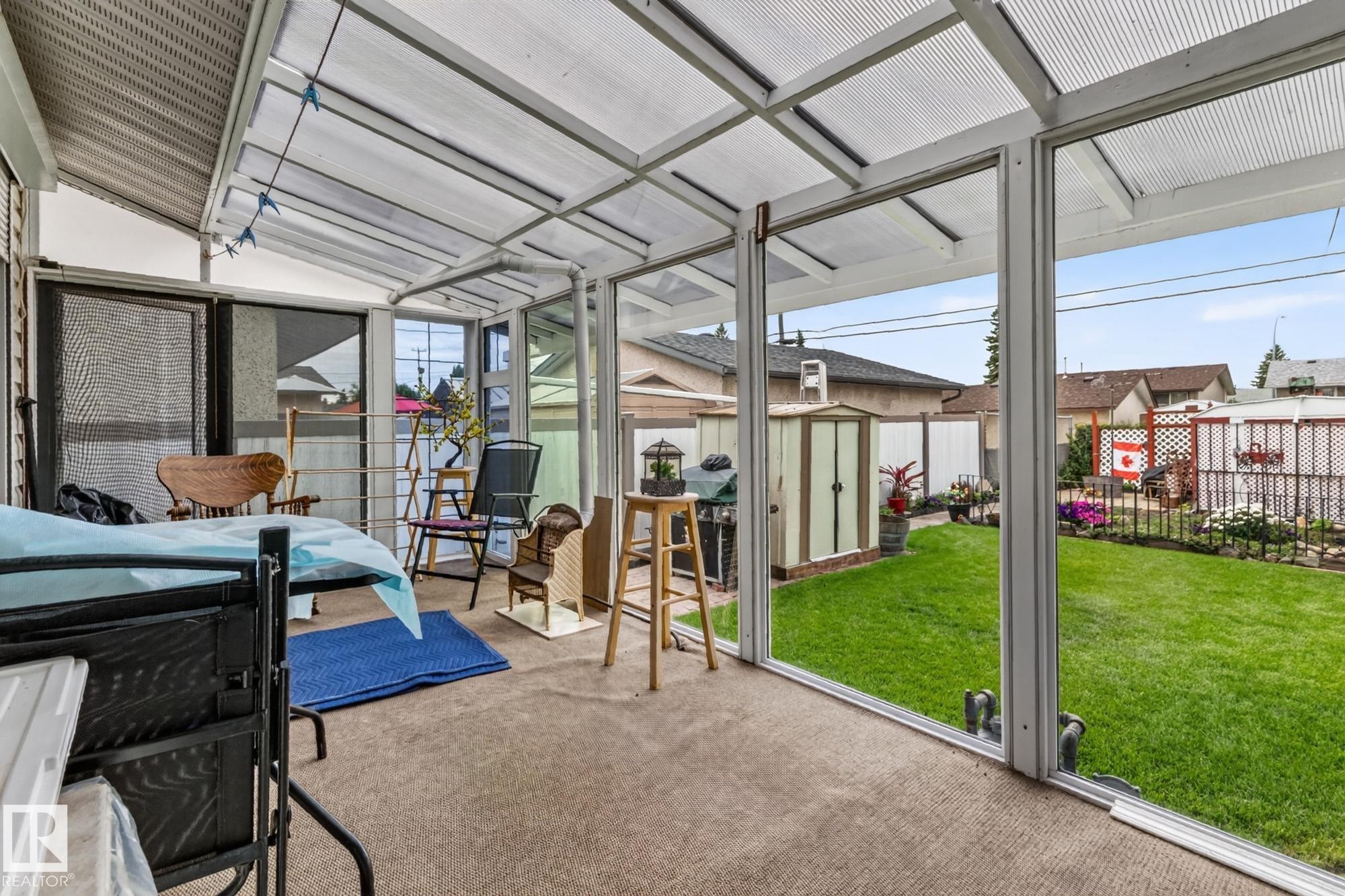 Enclosed patio with a transparent, structured roof and full-height glass panel walls - 13432 134 Street Nw, Edmonton, AB - Photo Showing Other Room
