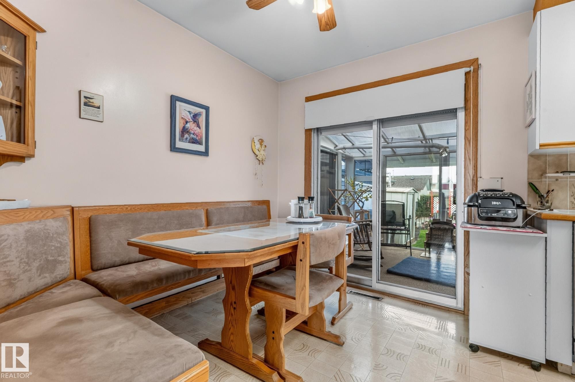 Built-in banquette seating with wood framing - 13432 134 Street Nw, Edmonton, AB - Indoor Photo Showing Dining Room